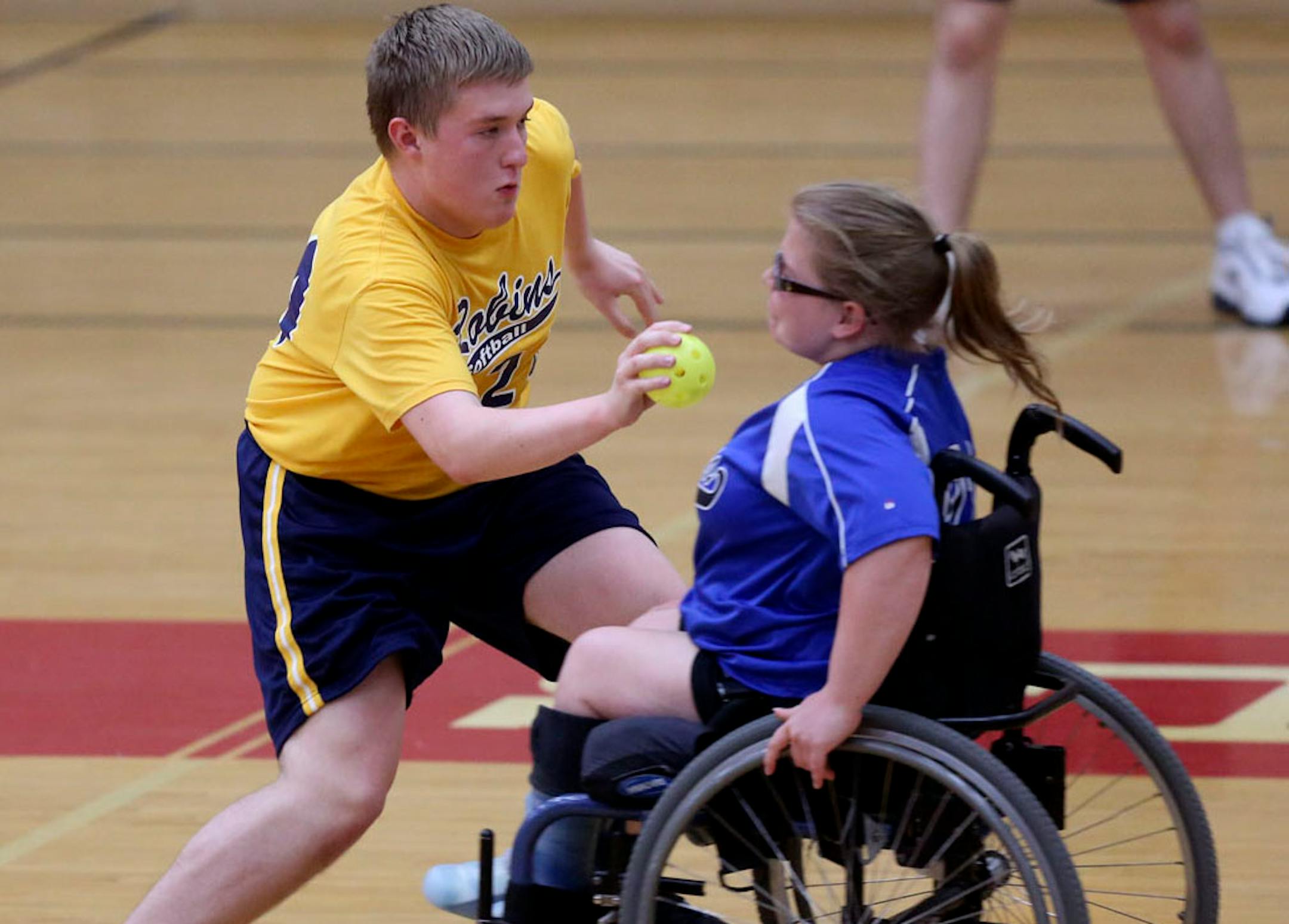 The Robins Mike Madson tagged out Dakota United's Armette Damon in the fifth inning during the state championship for physically impaired adapted softball.