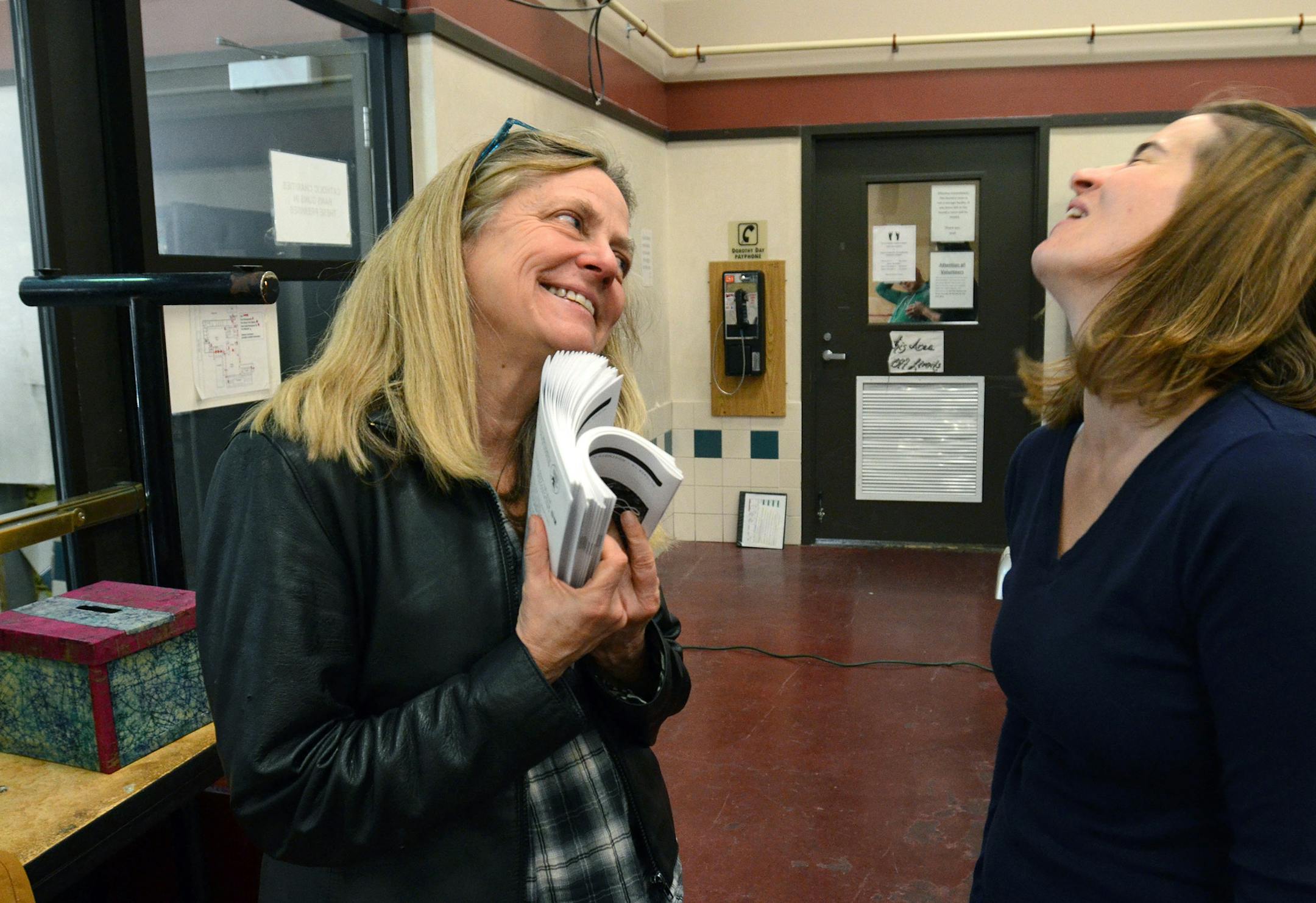 (At left) Michelle Hensley is the founder and artistic director of Ten Thousand Things, which brings professional theater to those with little access to the arts. Hensley spoke to performer Elise Langer at the Dorothy Day Center before the performance of "A Midsummer Night's Dream". ] Joey McLeister,Special to the Star Tribune,St.Paul,MN October16,2013