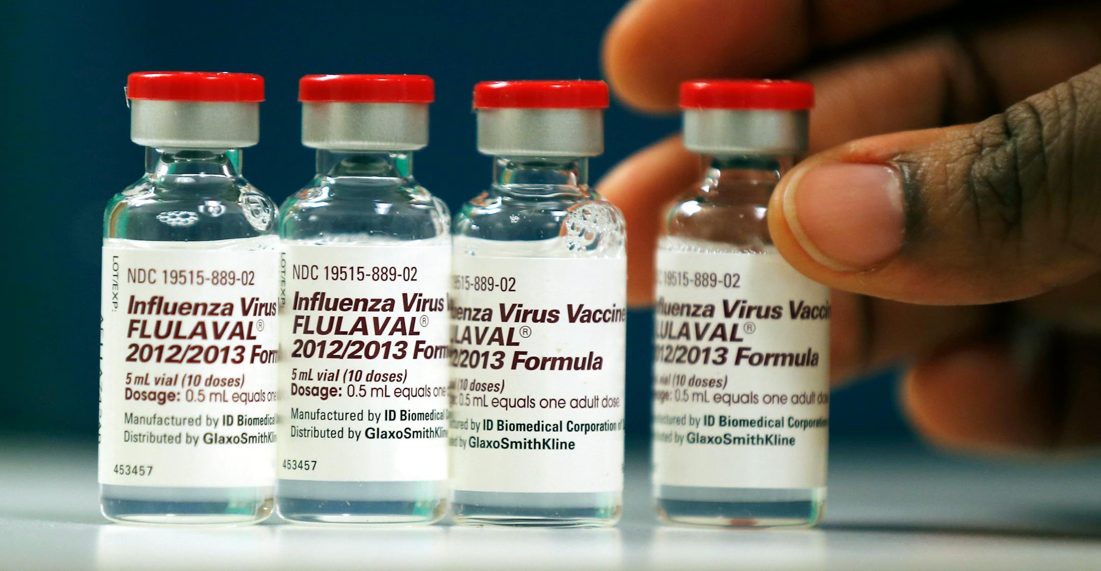 Vials of flu vaccine are displayed at the Whittier Street Health Center in Boston, Mass., Wednesday, Jan. 9, 2013. Boston declared a public health emergency Wednesday as the city tried to deal with a harsh flu season and the state reported 18 flu-related deaths so far. (AP Photo/Charles Krupa)