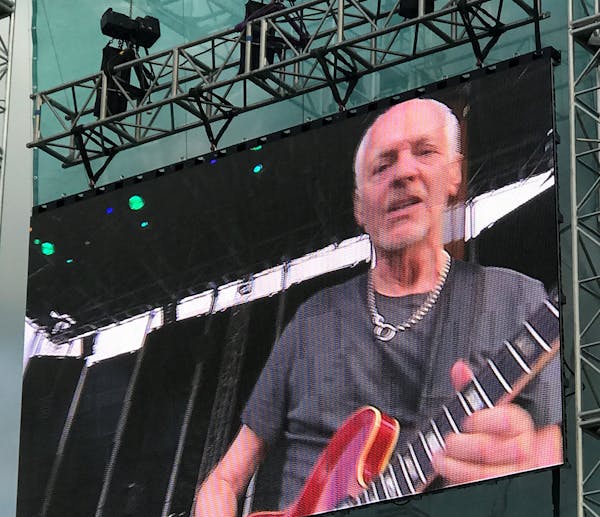 Peter Frampton is shown on the video screen during his concert at Treasure Island Casino in Red Wing, shortly before he walked offstage in annoyance.