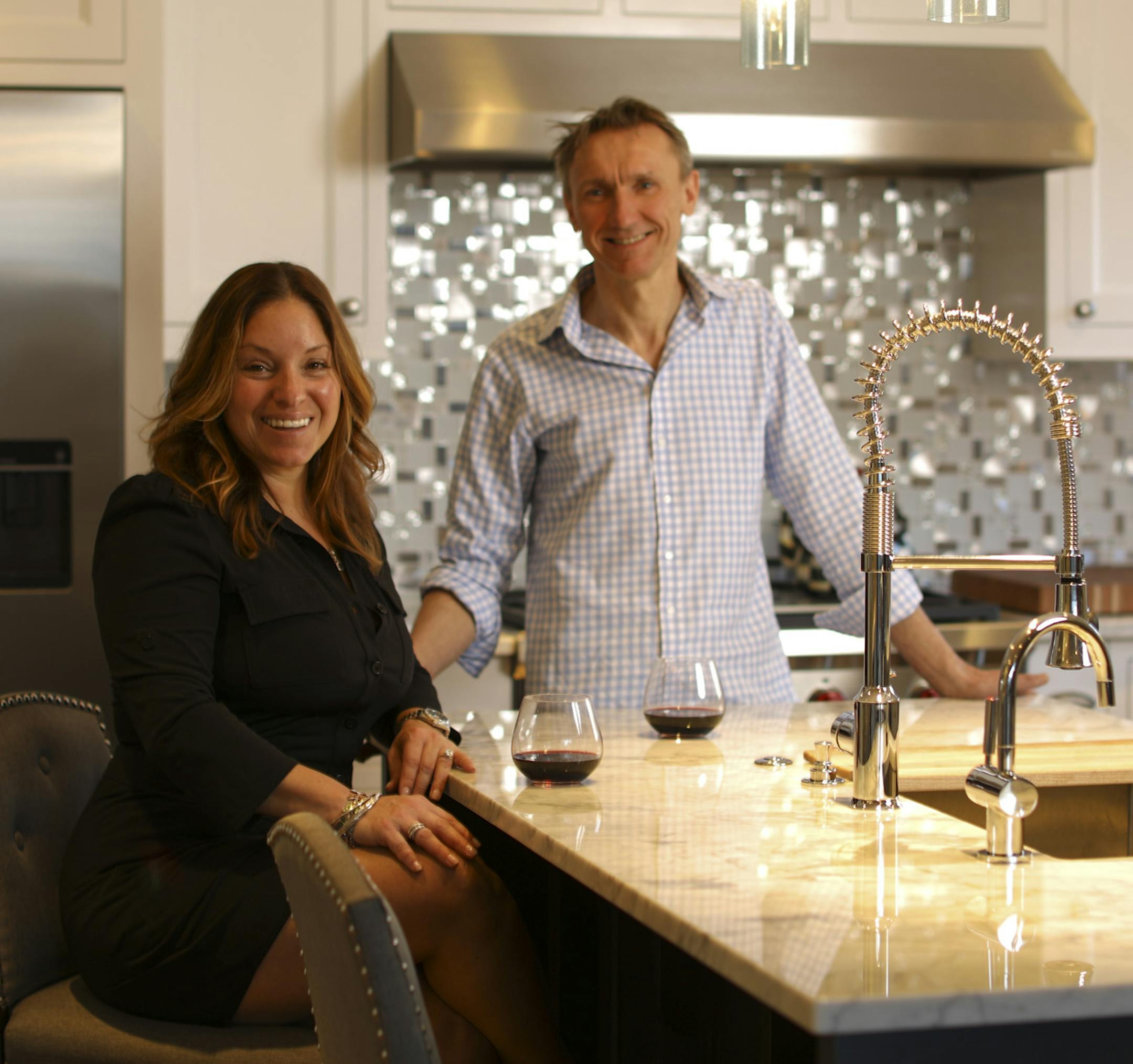 Rebecca Illingworth Penichot and Thierry Penichot in their newly remodeled kitchen, which was designed for casual entertaining.