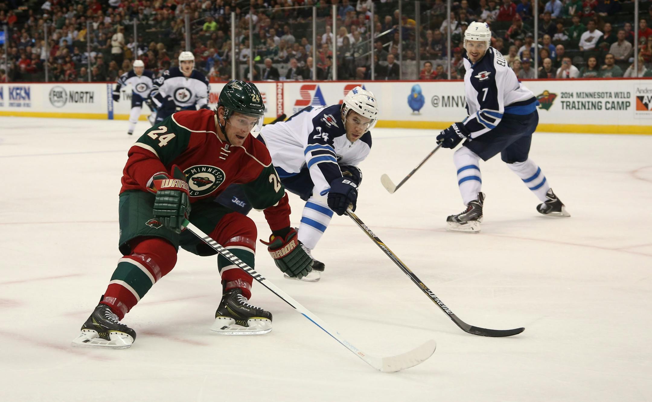 Matt Cooke tried to pass the Jets Grant Clitsome on his way to the goal during the first period in this preseason game. Cooke was injured in the second game of the regular season and plans to return Saturday at home against Nashville.