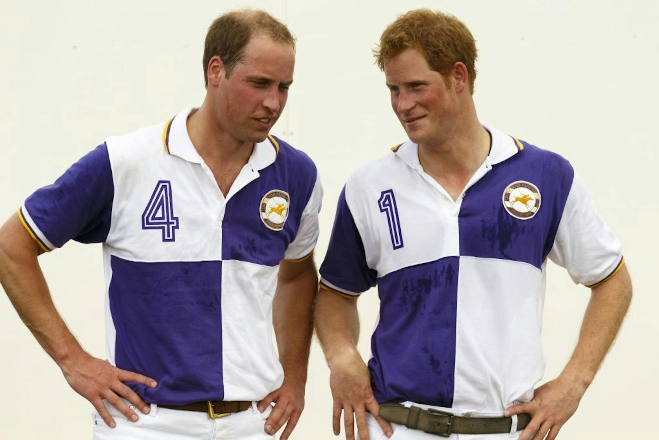 Prince William, the Duke of Cambridge, right, and Prince Harry chat after The Jerudong Trophy at Cirencester Park Polo Club in Gloucestershire Sunday July 14, 2013. Many in the British press have predicted that the first child of the prince and the Duchess of Cambridge, formerly known as Kate Middleton, was expected to arrive on Sunday but the prince was enjoying a game of polo against his brother Prince Harry at a charity event. (AP Photo/ Chris Ison, PA) UNITED KINGDOM OUT - NO SALES - NO ARCH