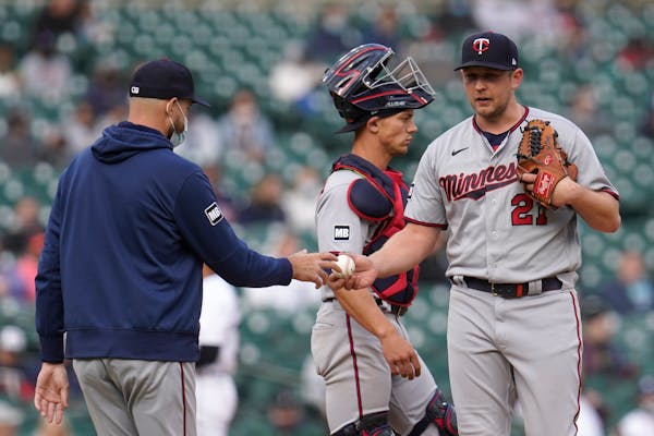 Twins manager Rocco Baldelli takes the ball from relief pitcher Tyler Duffey in the seventh inning of Saturday's loss.