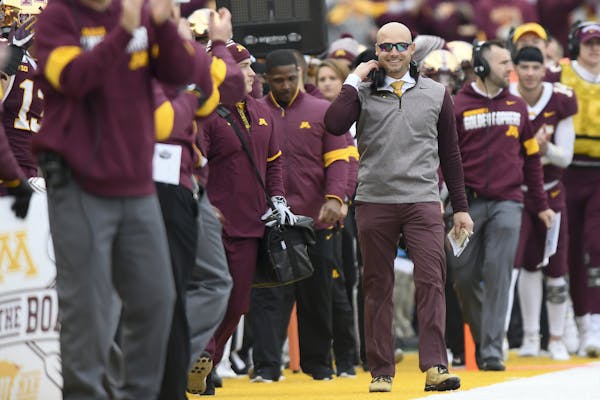 Minnesota Gophers head coach P.J. Fleck was all smiles after a first down reception by wide receiver Rashod Bateman (13) in the second half. ] Aaron L