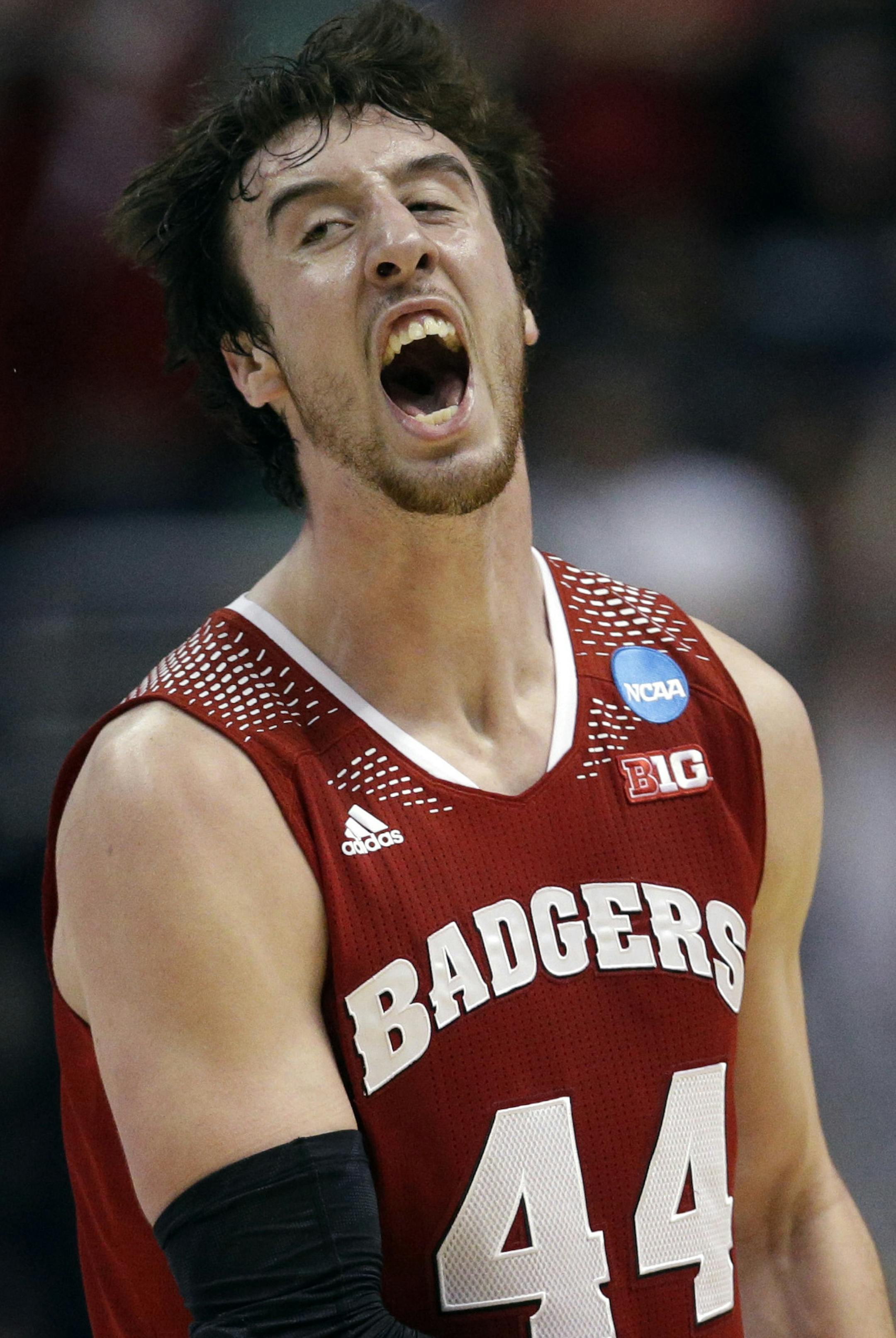 Wisconsin 's Frank Kaminsky reacts after making a three-point basket during the second half in a regional final NCAA college basketball tournament game against Arizona, Saturday, March 29, 2014, in Anaheim, Calif. (AP Photo/Jae C. Hong)