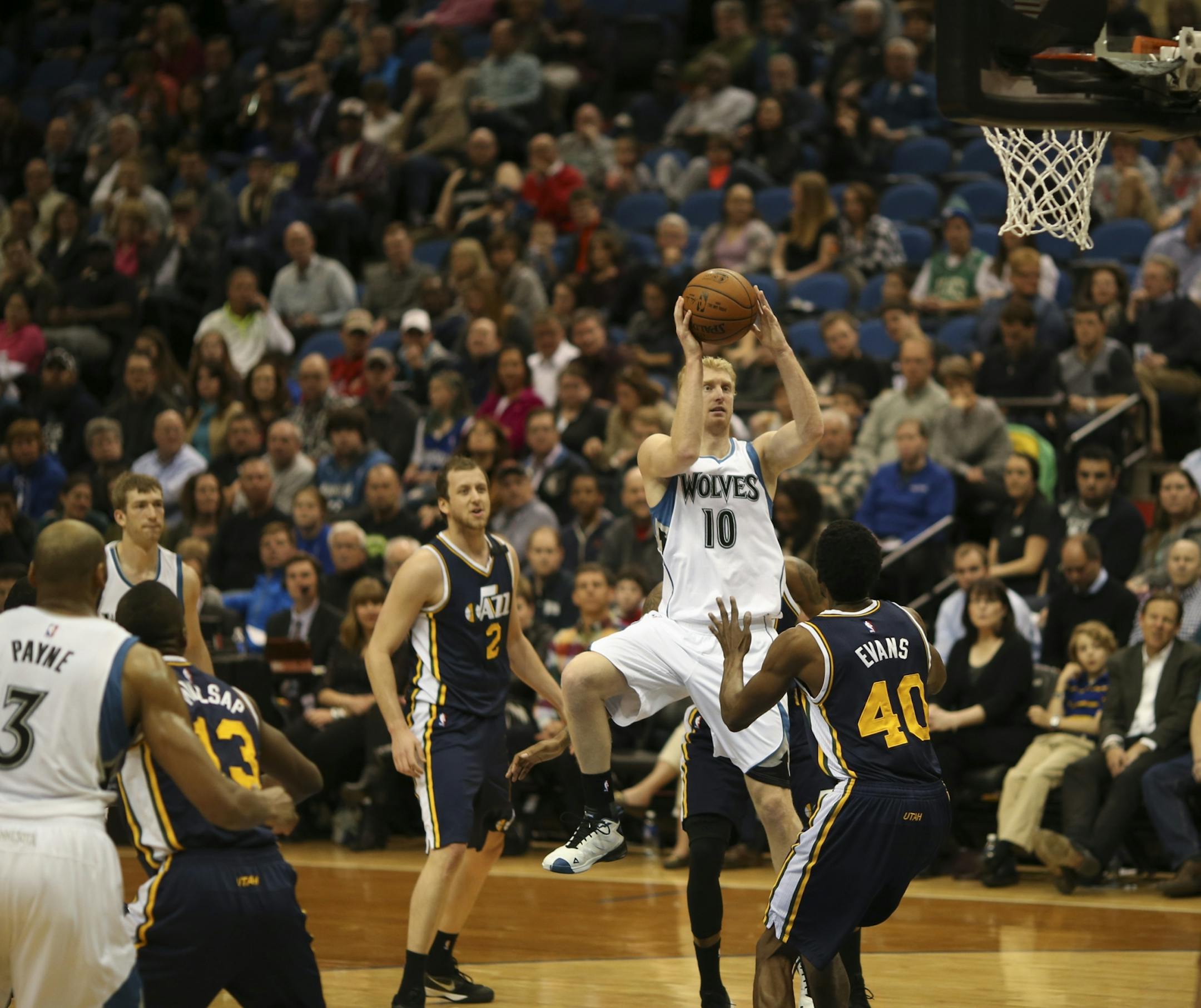 Minnesota Timberwolves forward Chase Budinger went up for a second quarter shot over Utah Jazz forward Jeremy Evans (40) Monday night at Target Center.