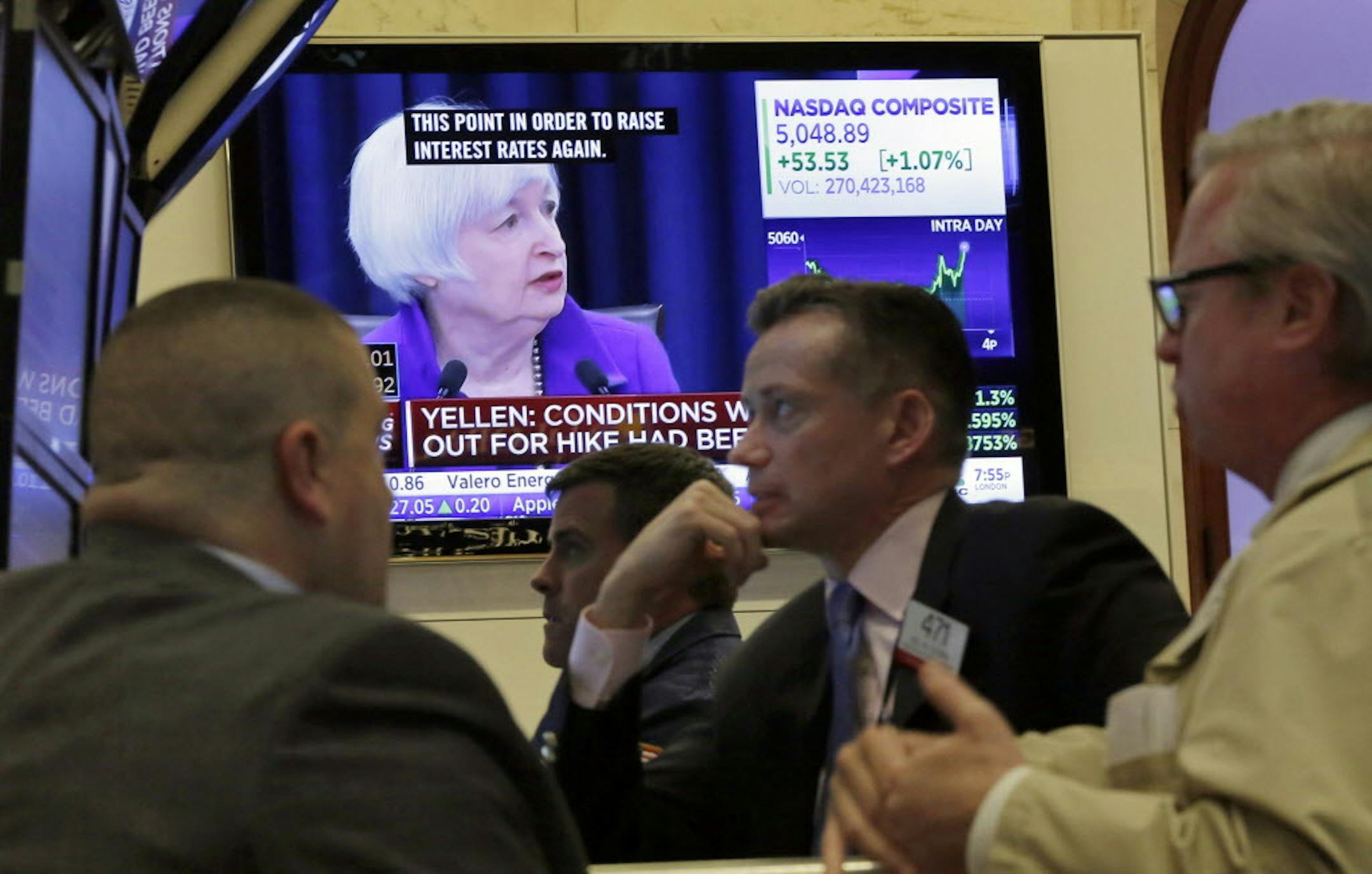 FILE - In this Wednesday, Dec. 16, 2015, file photo, Federal Reserve Chair Janet Yellen's Washington news conference is shown on a television screen on the floor of the New York Stock Exchange. Wall Street watched few things more closely this year than the Federal Reserve. Despite veering between record highs and the steepest dive in four years, the stock market is on track to end the year essentially flat. (AP Photo/Richard Drew, File)