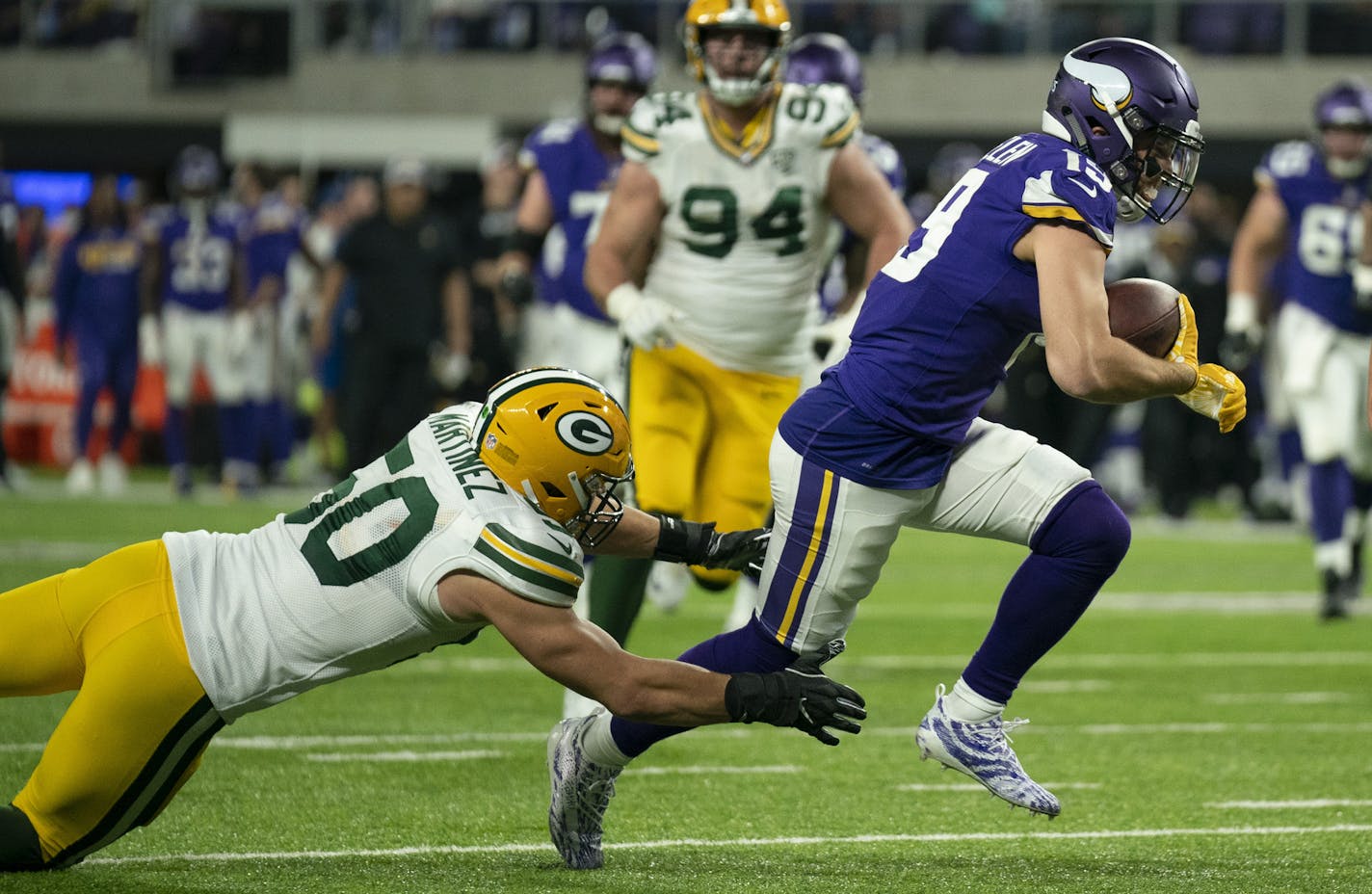 Minnesota Vikings wide receiver Adam Thielen (19) eluded the grasp of Green Bay Packers inside linebacker Blake Martinez (50) and headed for the end zone on a 14 yard touchdown reception in the fourth quarter. ] JEFF WHEELER &#xef; jeff.wheeler@startribune.com The Minnesota Vikings defeated the Green Bay Packers 24-17 in an NFL Sunday Night Football game at U.S. Bank Stadium in Minneapolis Sunday, November 25, 2018.