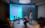 The meditation room features a large bubble wall and soft lighting.