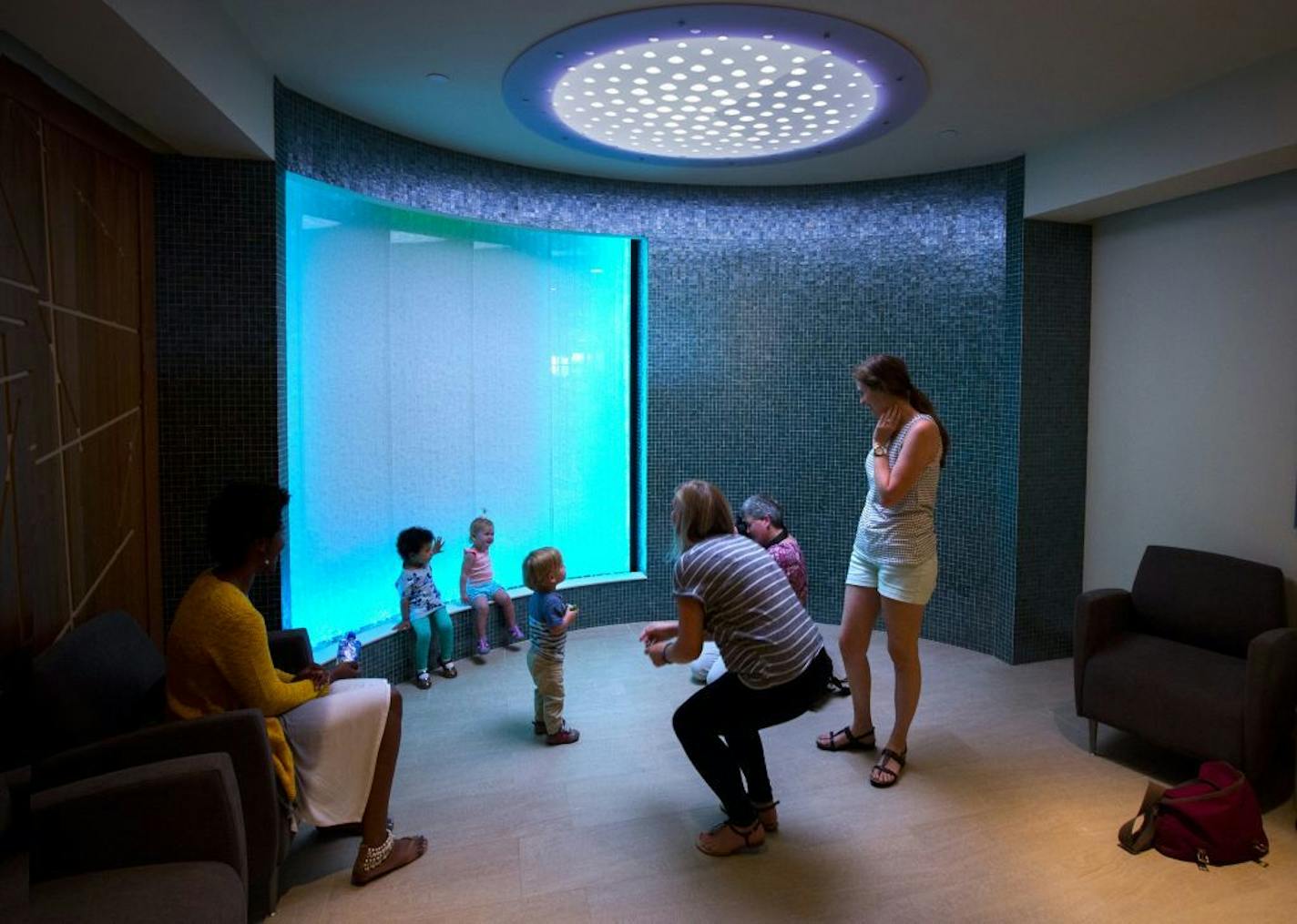 The meditation room features a large bubble wall and soft lighting.