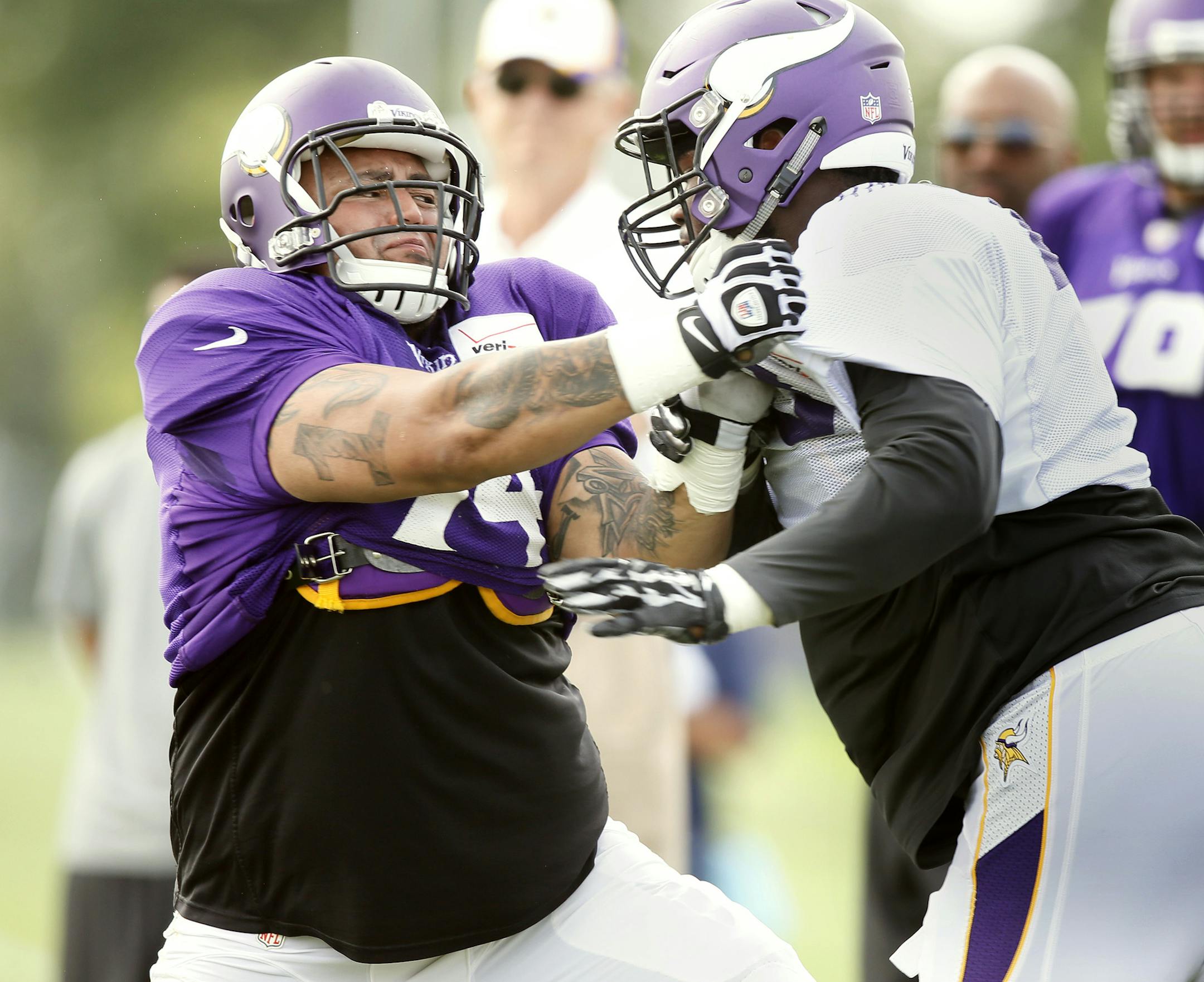 Sharrif Floyd right pushed Charlie Johnson backwards during NFL camp at Minnesota State University , Mankato Wednesday July 30, 2014 in Mankato, MN . ] Jerry Holt Jerry.holt@startribune.com