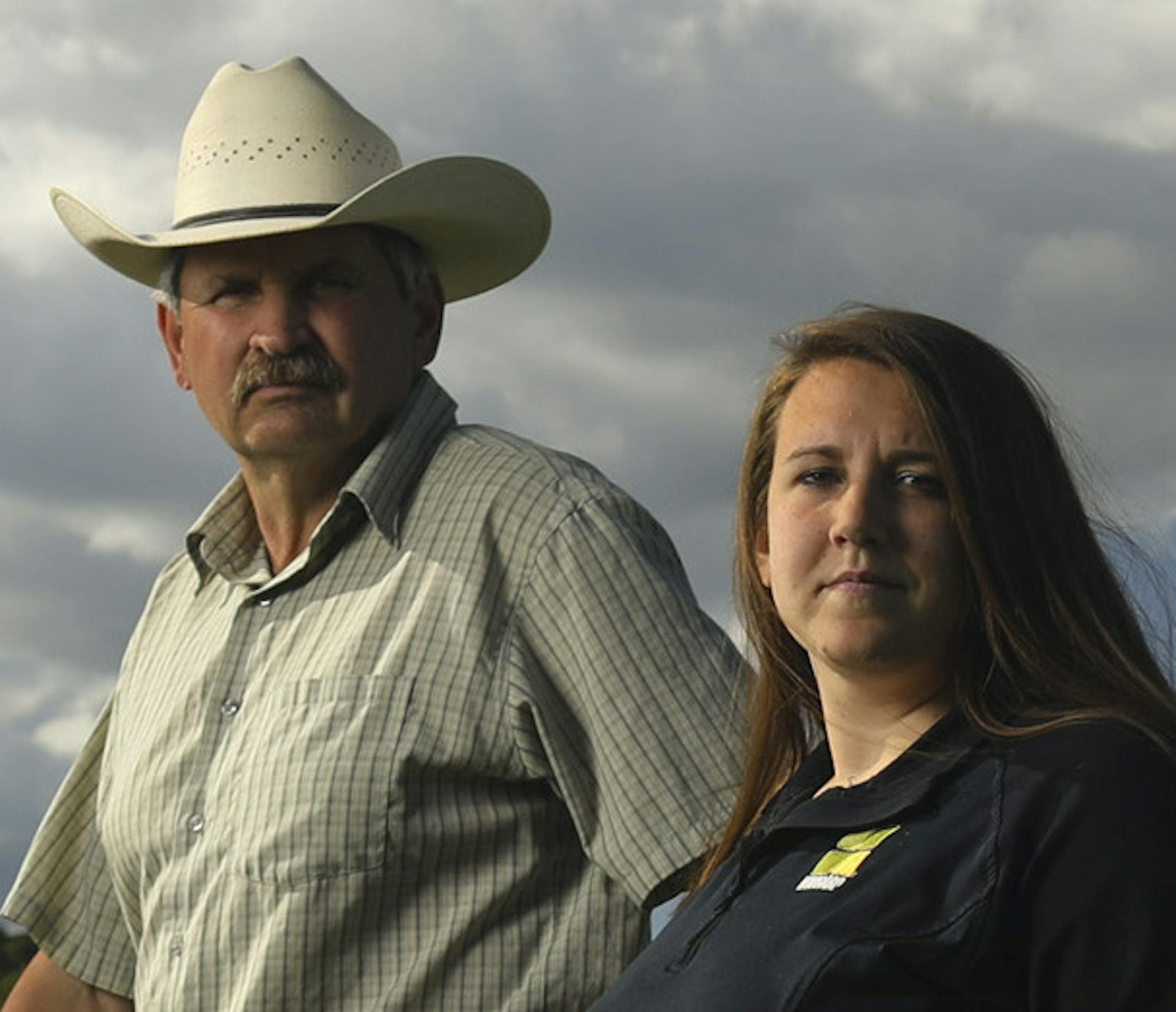 Willard Drysdale with his daughter, Chelsey, who helps run his cattle operation. The field to the right, which is pasture in the foreground, and planted in corn beyond that, would all be buried in dredge sand if the Corps of Engineers has it's way. ] JEFF WHEELER ï jeff.wheeler@startribune.com Willard Drysdale learned last month that the U.S. Army Corps of Engineers has chosen his farm as the best site to dump 7 million cubic yards of sand dredged from the Mississippi River over the next 40