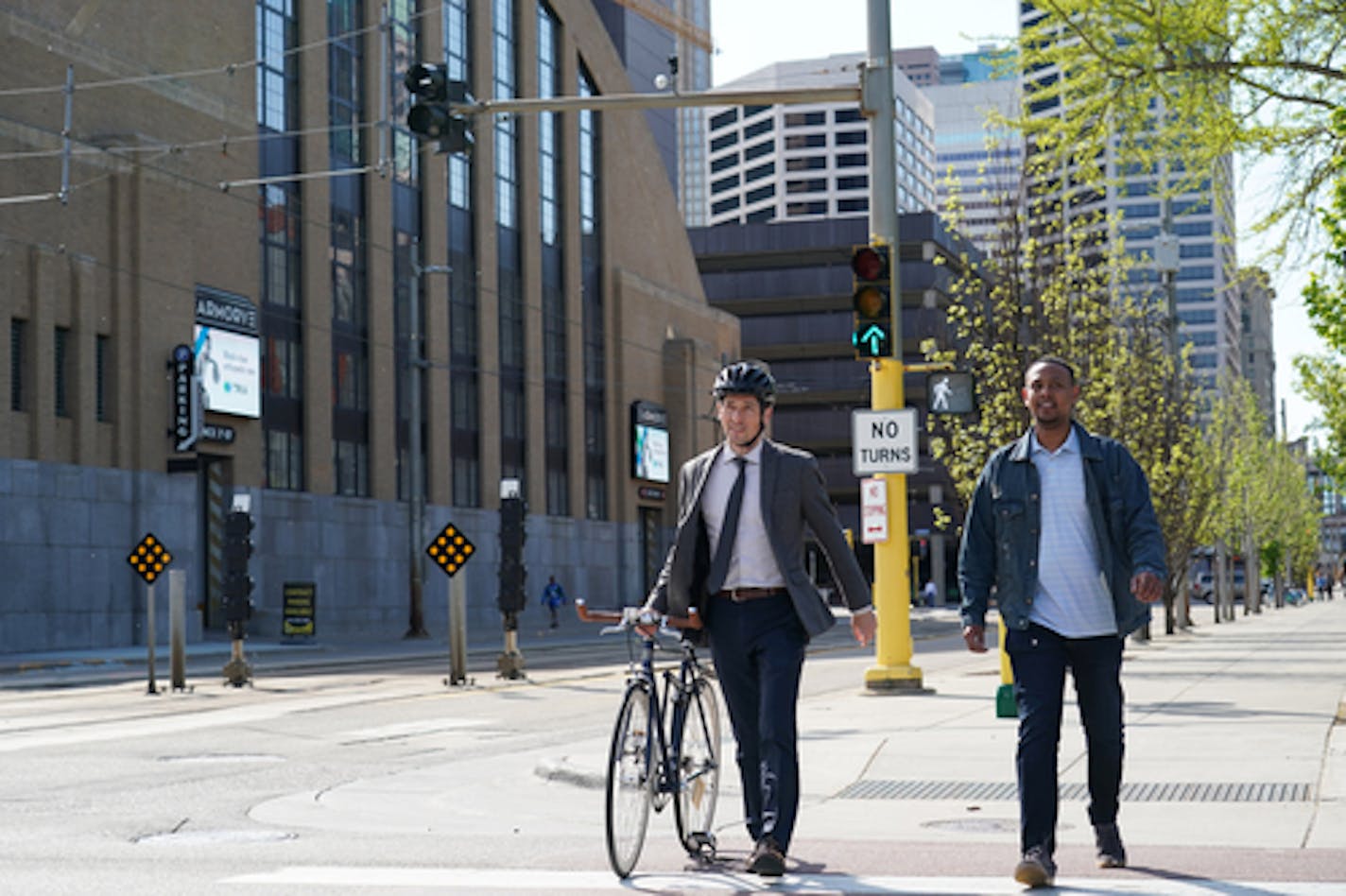 Abdi Nur Salah, right, photographed with Minneapolis Mayor Jacob Frey in 2019, is a former aide to Frey and is among the dozens indicted in connection with a sweeping scheme to defraud the government of millions meant to feed children. Frey is not part of the fraud case.