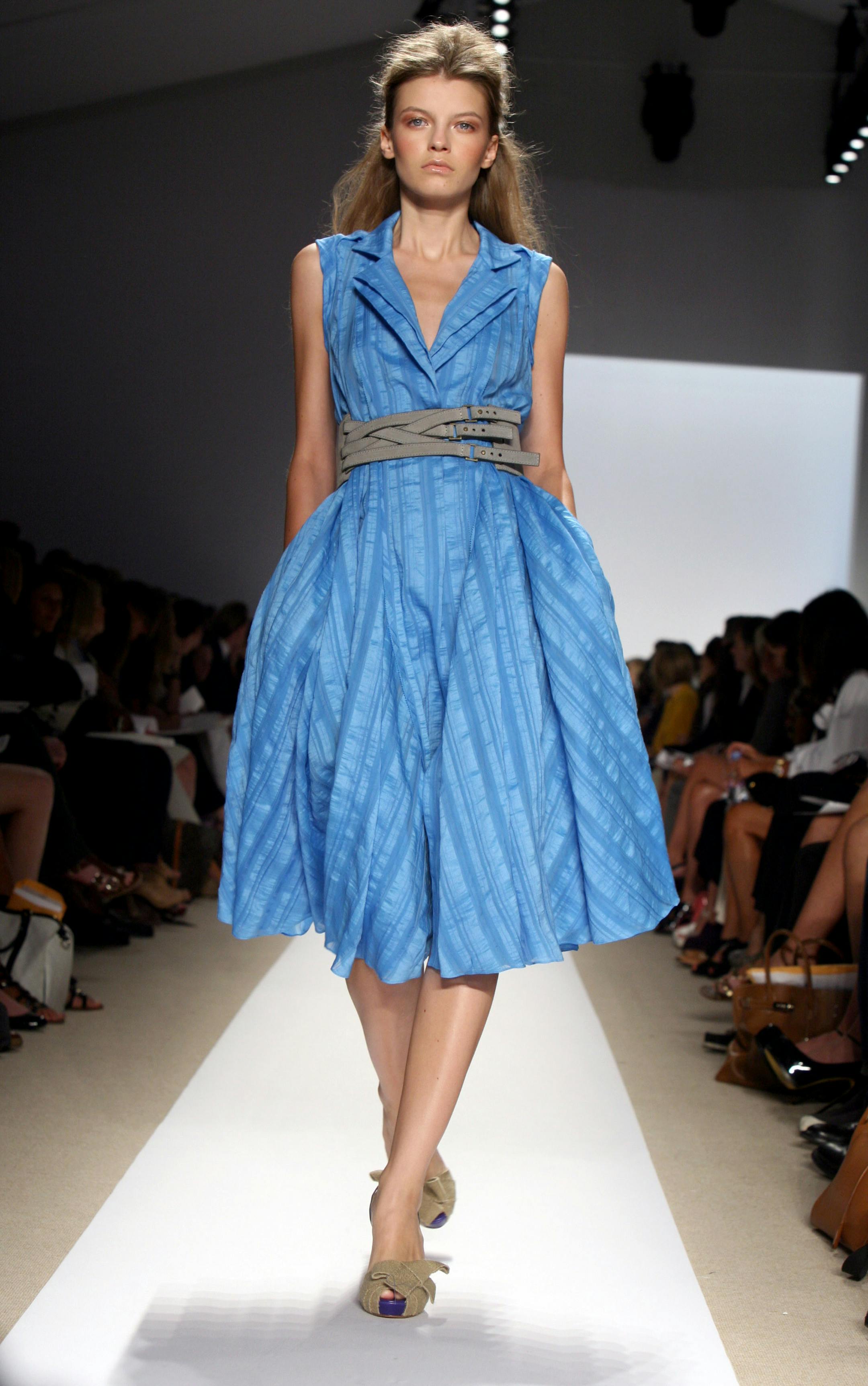 In this Monday, Sept. 8, 2008 file photo, the Peter Som spring 2009 collection is modeled during Fashion Week in New York. Economic volatility and uncertainty about the U.S. presidential election have resulted in many high-end stores delaying some of their spring ordering. Among the buyers who are placing orders, rather than playing it safe with classic items, they're looking for pieces that are bold and eye-catching without being too far out.