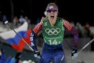 Jessica Diggins, of the United States, celebrates after winning the gold medal in the during women's team sprint freestyle cross-country skiing final 