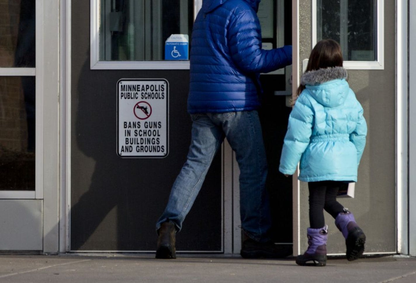 Seward Montessori School in Minneapolis was locked down Wednesday after police discovered a teacher's aide had a loaded handgun in her locker.