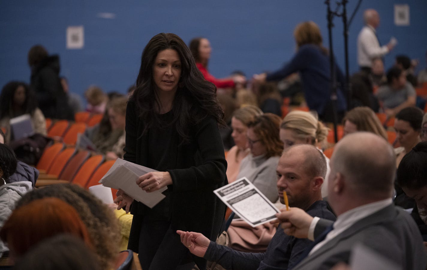 Michelle Kellogg collected questions from audience members at a Minneapolis Public Schools community meeting Monday night at Northeast Middle School.