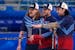United States’ Matt Hamilton, left, John Shuster, centre, and Christopher Plys discussed a shot during the semifinal loss to Great Britain.
