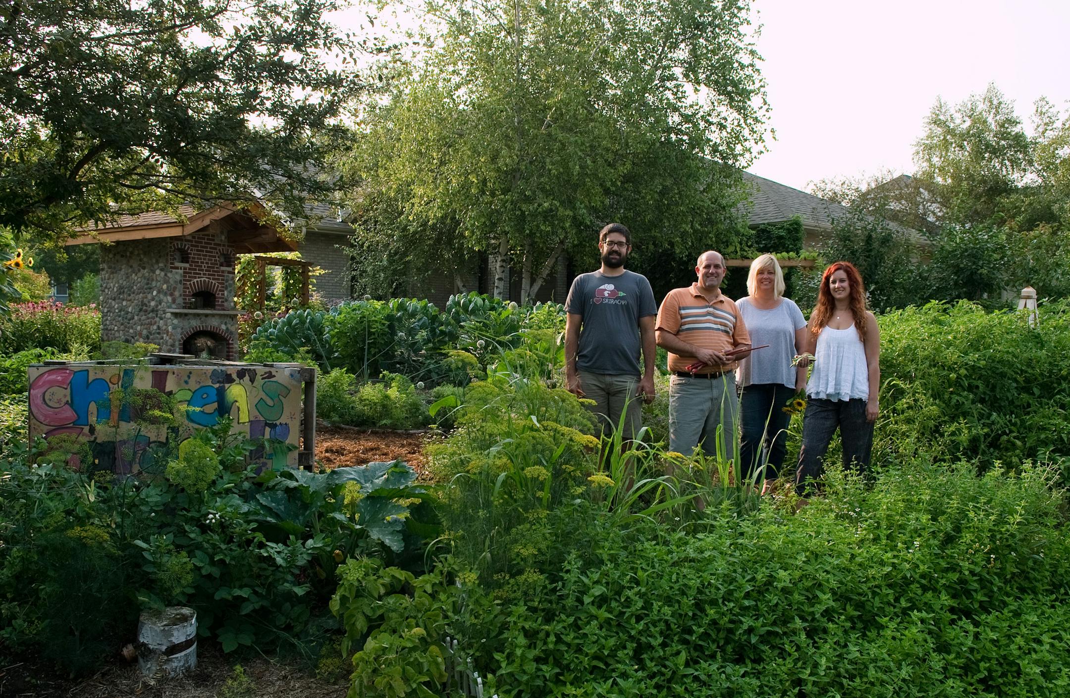 The Schoenherrs -- from left, Aaron, John, Catherine and Andrea -- are maintaining an ambitious front-yard garden begun last year as a prototype.