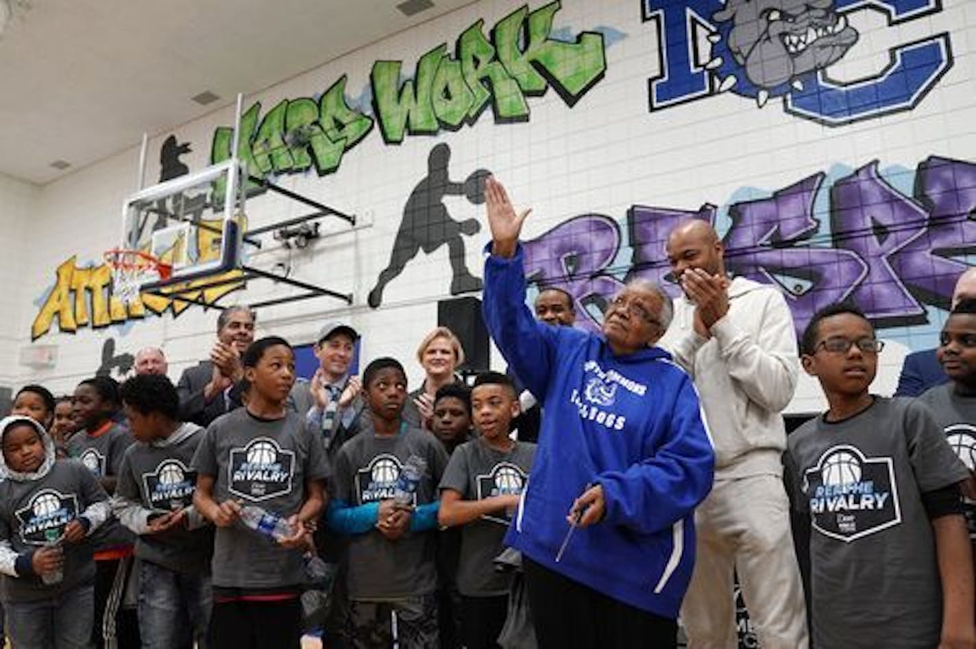 Willie B. Japser, who has worked at the North Commons Recreation Center for 29 years, was emotional after cutting the ceremonial ribbon during a dedication for the finished Final Four "Legacy Project" basketball court at the North Commons Recreation Center.