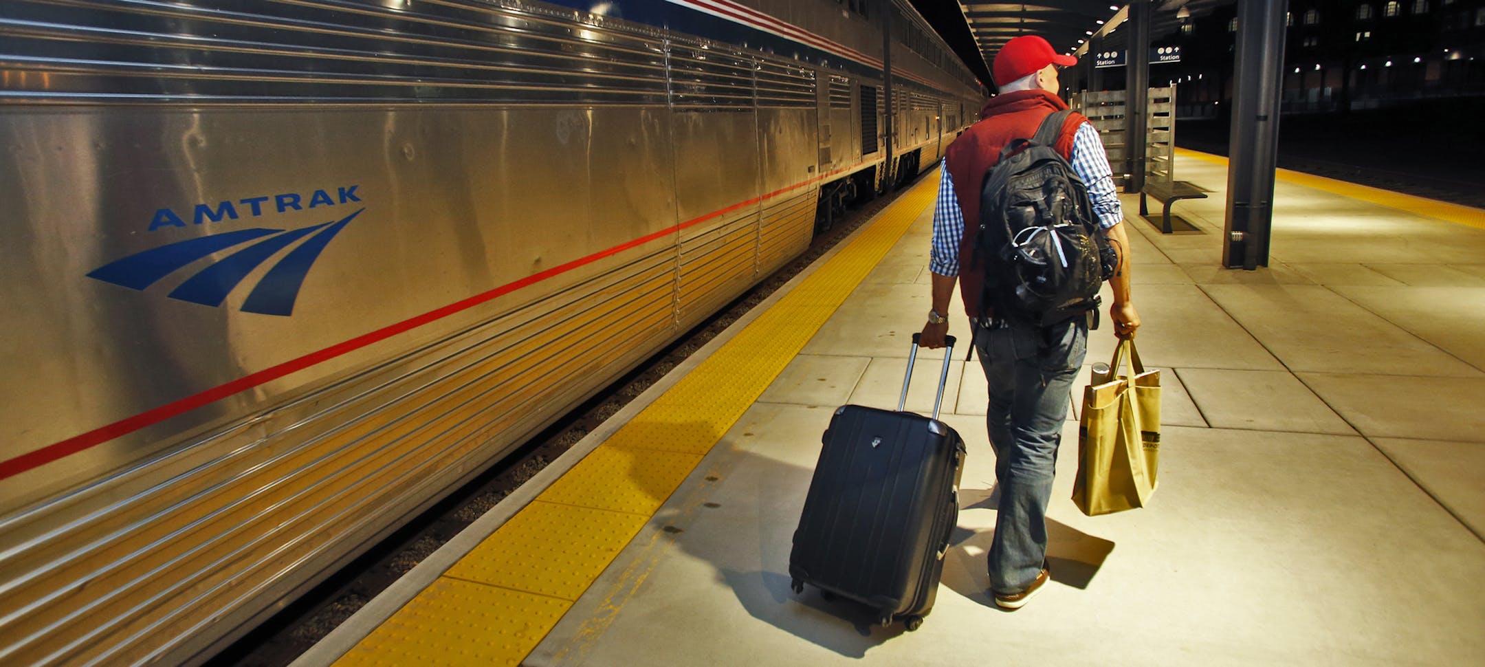 Tim Pomaville of Chicago was the first passenger to step foot on the St. Paul Union Depot platform. ] The first train to pull in to downtown St. Paul in forty years arrived at the newly renovated Union Depot - an Amtrak arrival from Chicago. . (MARLIN LEVISON/STARTRIBUNE(mlevison@startribune.com) ORG XMIT: MIN1405080134366751