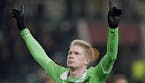 Wolfsburg's Kevin De Bruyne celebrates after scoring his side's thrid goal during the Europa League round of sixteen first leg soccer match between Vf