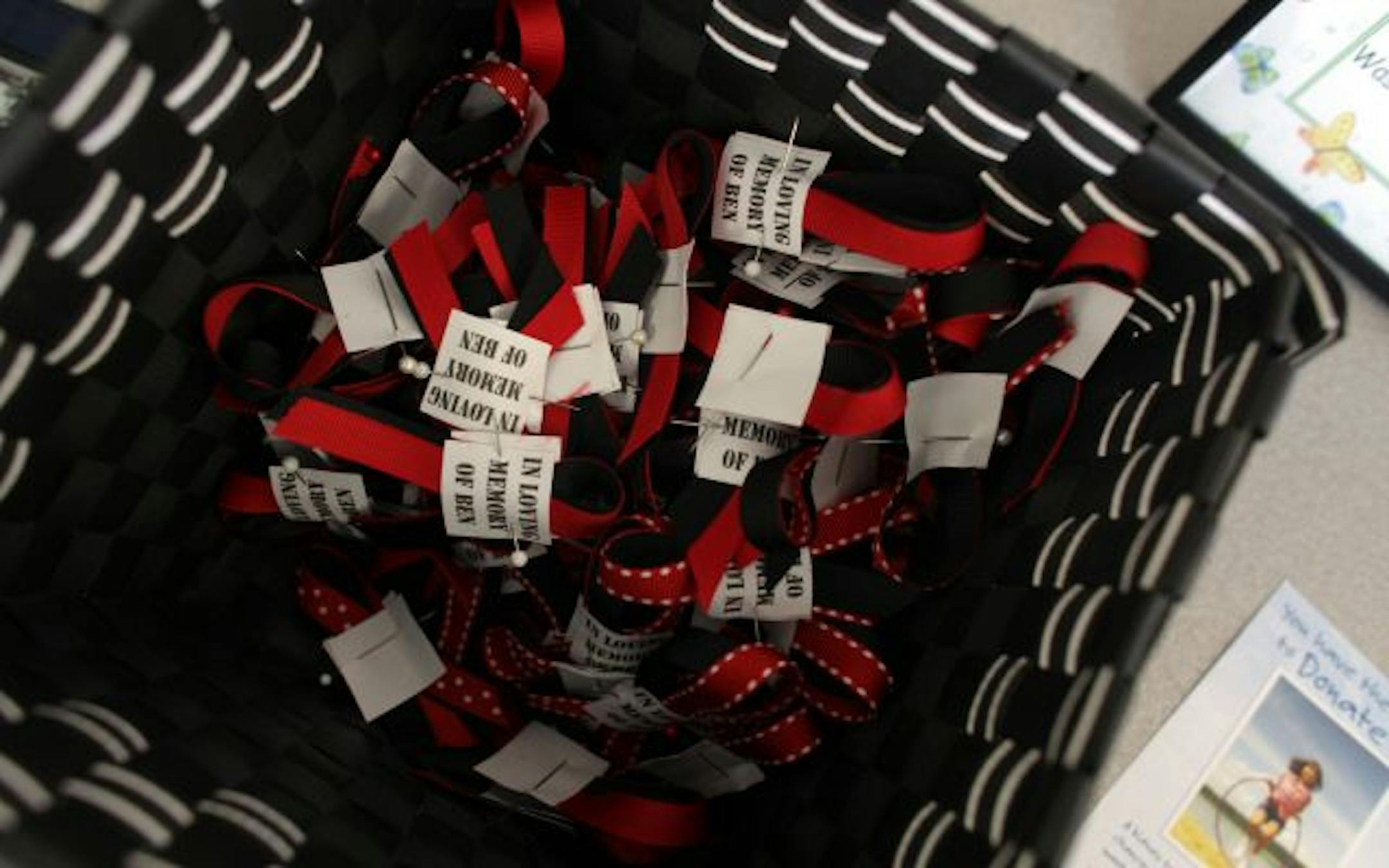 Pins were made for family and friends to help remember Corporal Benjamin Kopp during his funeral held at Rosemount High School.