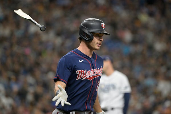 Minnesota Twins' Max Kepler flips his broken bat after hitting a single during the seventh inning of a baseball game against the Tampa Bay Rays, Satur