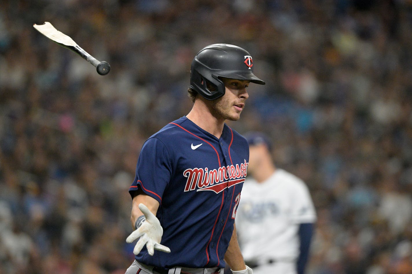 Minnesota Twins' Max Kepler flips his broken bat after hitting a single during the seventh inning of a baseball game against the Tampa Bay Rays, Saturday, April 30, 2022, in St. Petersburg, Fla. (AP Photo/Phelan M. Ebenhack)