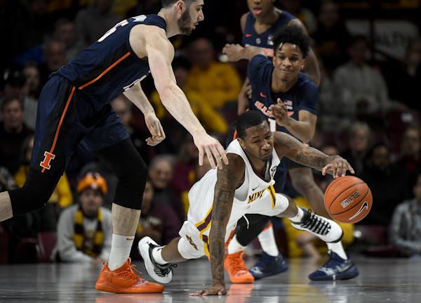 Minnesota Golden Gophers guard Dupree McBrayer (1) was able to regain control of a loose ball against the Illinois Fighting Illini in the first half W