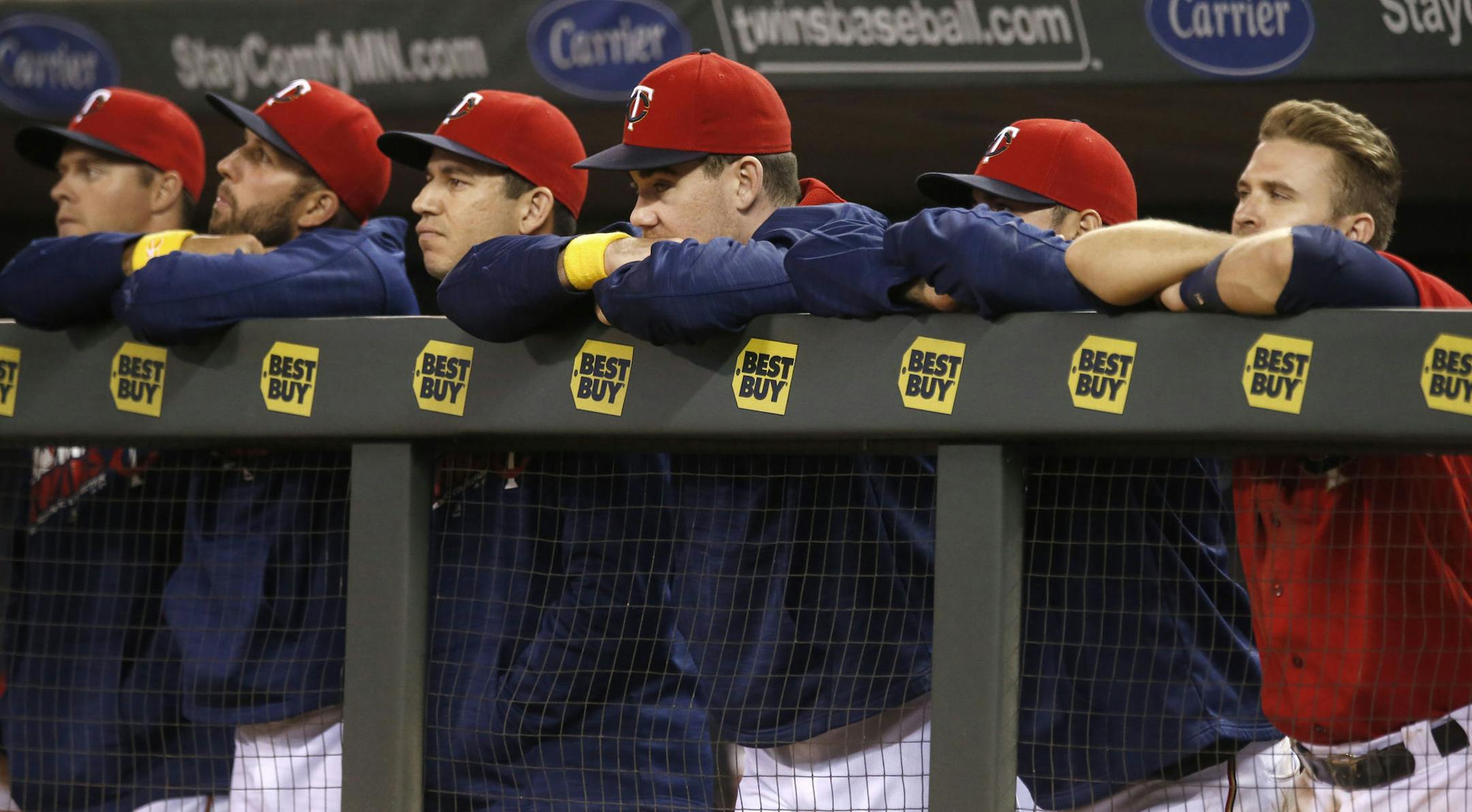 Minnesota Twins players lean on the dugout rail during the ninth inning of a baseball game against the Chicago White Sox on Friday, Sept. 2, 2016, in Minneapolis. The White Sox won 11-4. (AP Photo/Jim Mone)