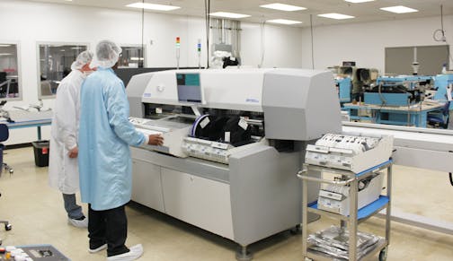 Employees at IntriCon work to manufacture and assemble hearing aids at the company&#xed;s plant in Arden Hills, Minn.