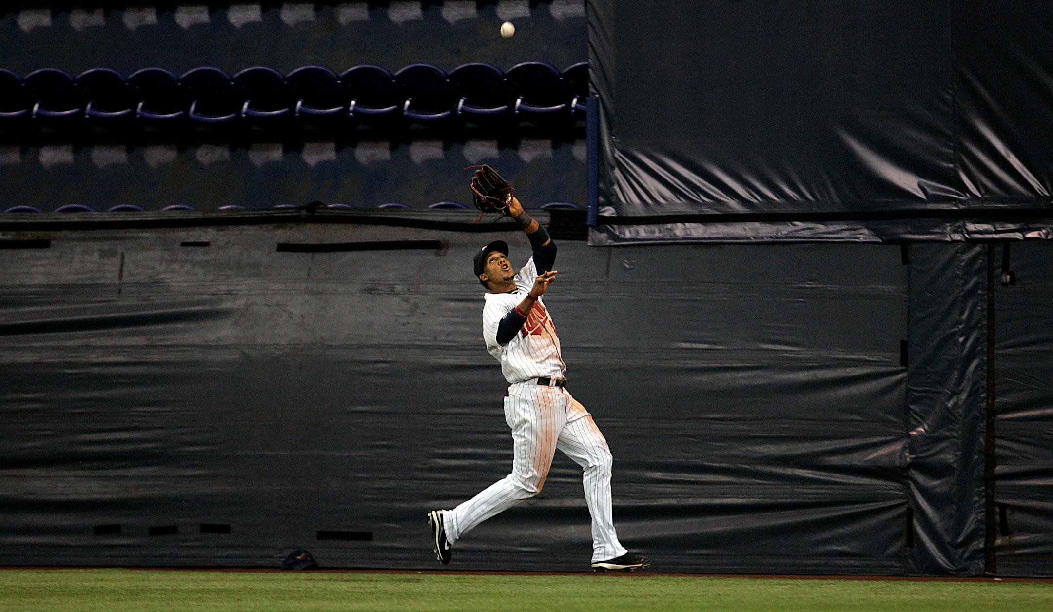 Twins center fielder Carlos Gomez ran down a long fly ball hit by Gary Matthews Jr. in the fifth, a play he made look easier than it was.