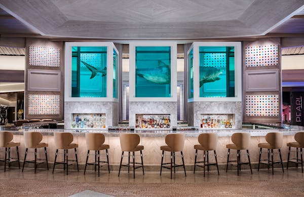 Damien Hirst's sculpture of an 13-foot tiger shark preserved in three tanks floats atop the The Palms' Unkown Bar and also inspired the name of Bobby 