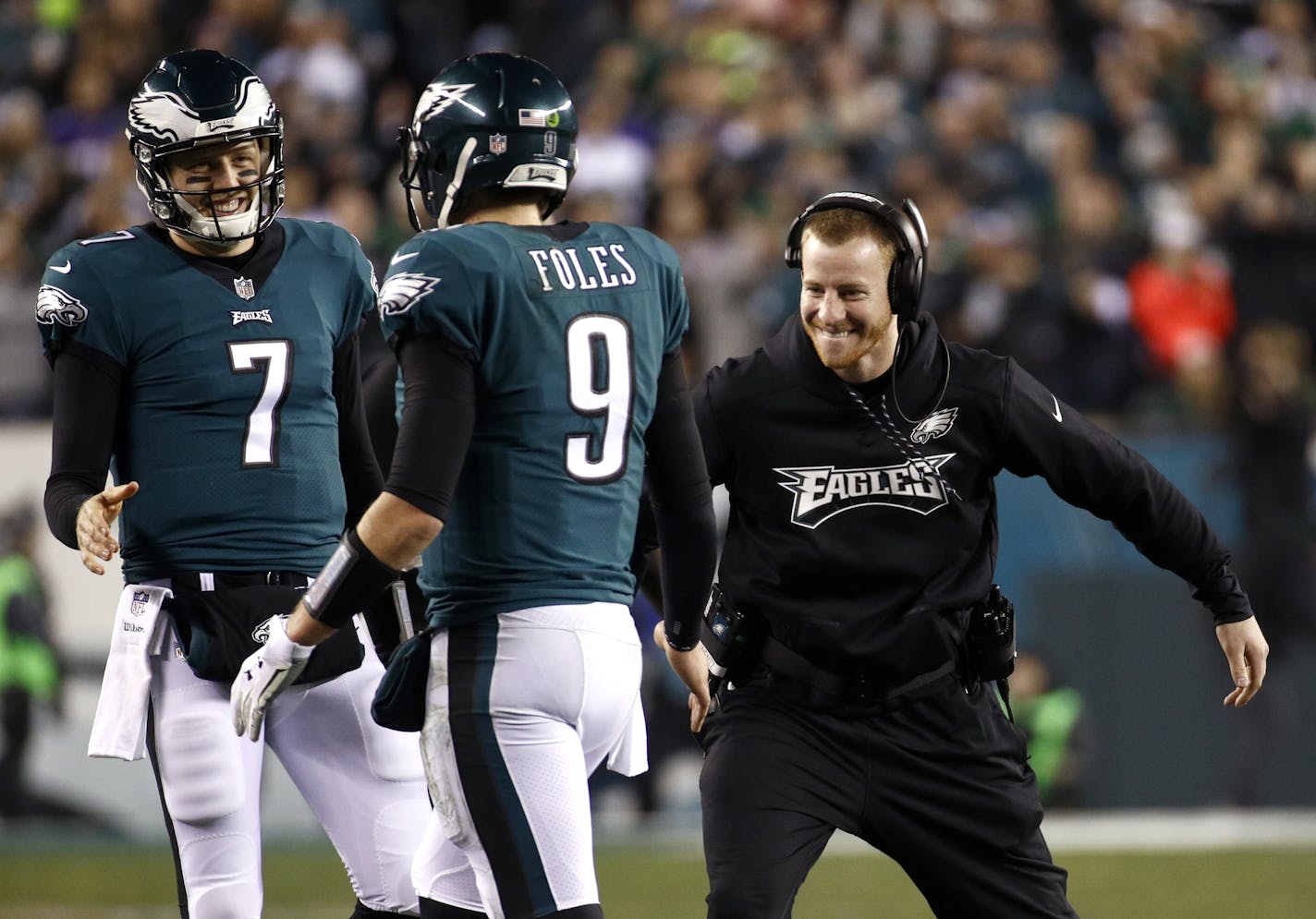 FILE - In this Sunday, Jan. 21, 2018, file photo, Philadelphia Eagles' Carson Wentz, right, congratulates Nick Foles (9) during the second half of the NFL football NFC championship game against the Minnesota Vikings in Philadelphia. Wentz, who is injured, watched both playoff games from the sideline, rooting hard for his teammates and enjoying their success without him. He'll be their No. 1 fan Sunday when they take on the New England Patriots and try to win the franchise's first NFL title since