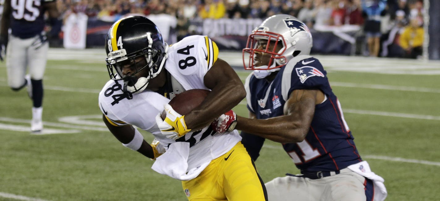 Pittsburgh Steelers wide receiver Antonio Brown (84) slips from the grasp of New England Patriots safety Malcolm Butler (21) in the first half of an NFL football game, Thursday, Sept. 10, 2015, in Foxborough, Mass. (AP Photo/Charles Krupa)