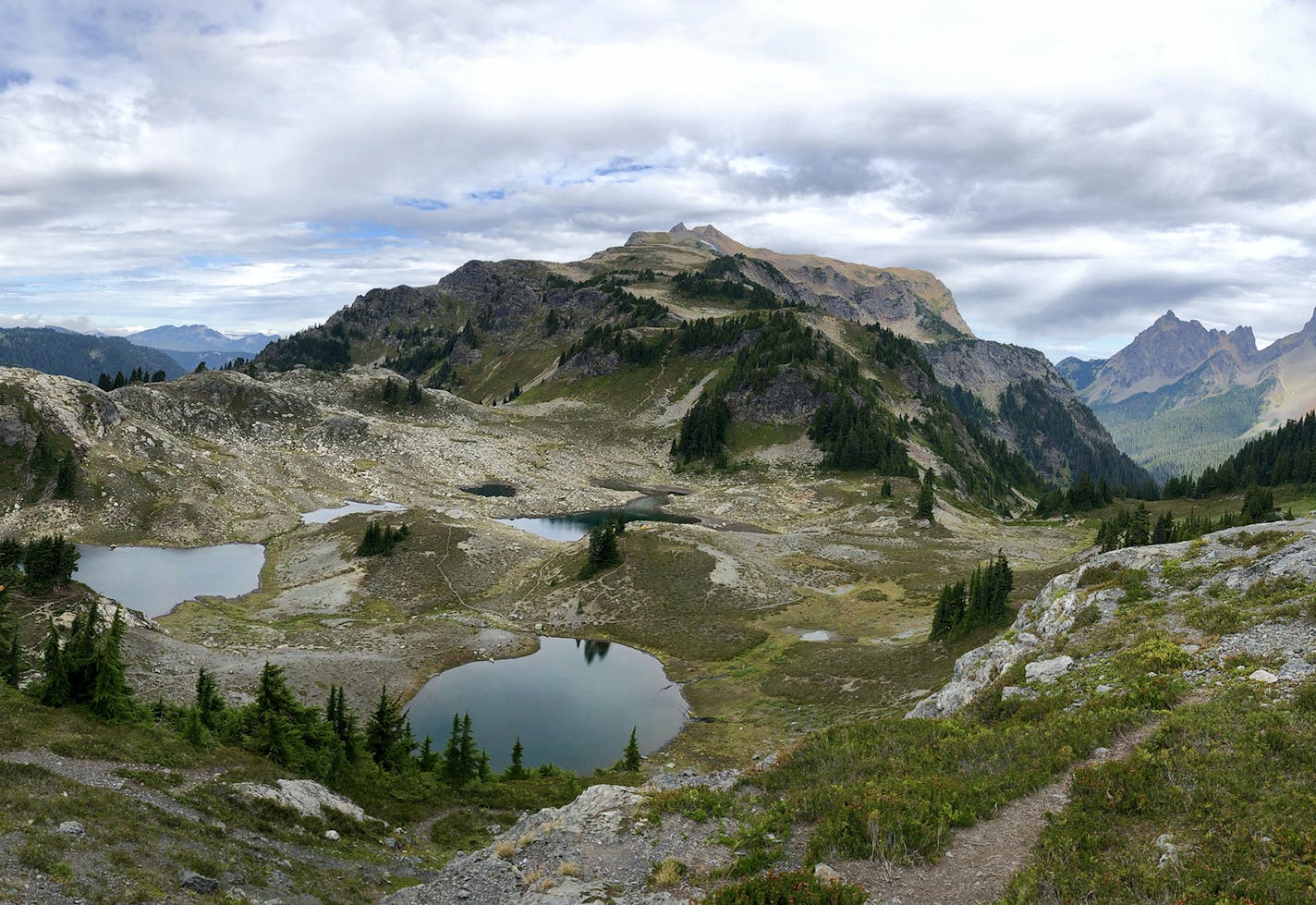 Can I have your name as you would like it to appear in print, and the town in which you live? Tom Singsank, Minnetonka Where were you when you took this photo? What does it show? This is on the Yellow Aster Butte Trail in the Mt Baker Wildnerness Area of the North Cascades. This photo was taken from the trail junction where the trail switchbacks down to a large butte filled w camping spots and small lakes. This was a great view of the expansive and rugged nature of the North Cascades, w Mt Baker