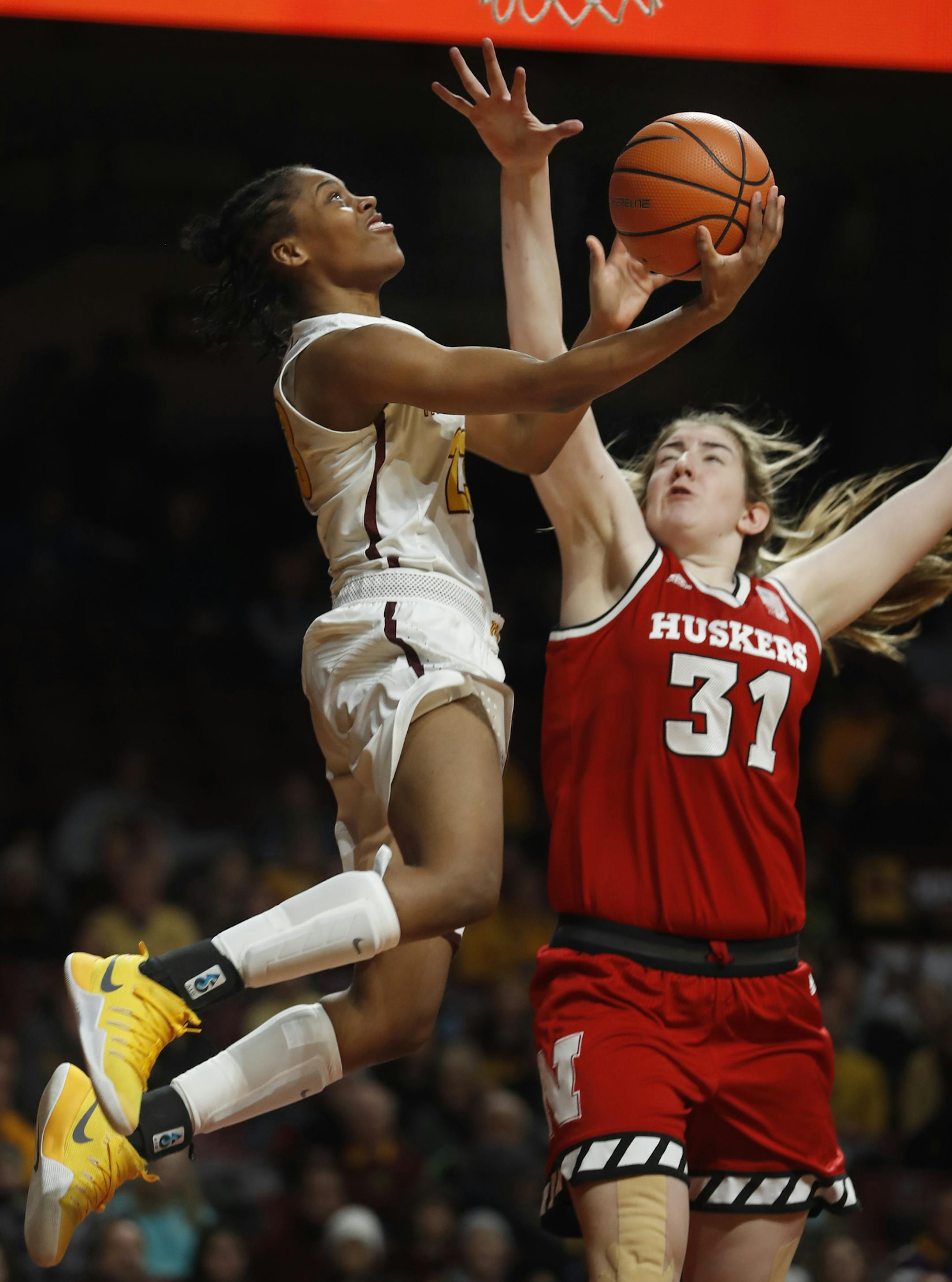 Gophers Kenisha Bell(23) makes a layup against Kate Cain(31).]Game coverage of women's basketball from Nebraska vs Gophers at Williams Arena.Richard Tsong-Taatarii&#xef;rtsong-taatarii@startribune.com
