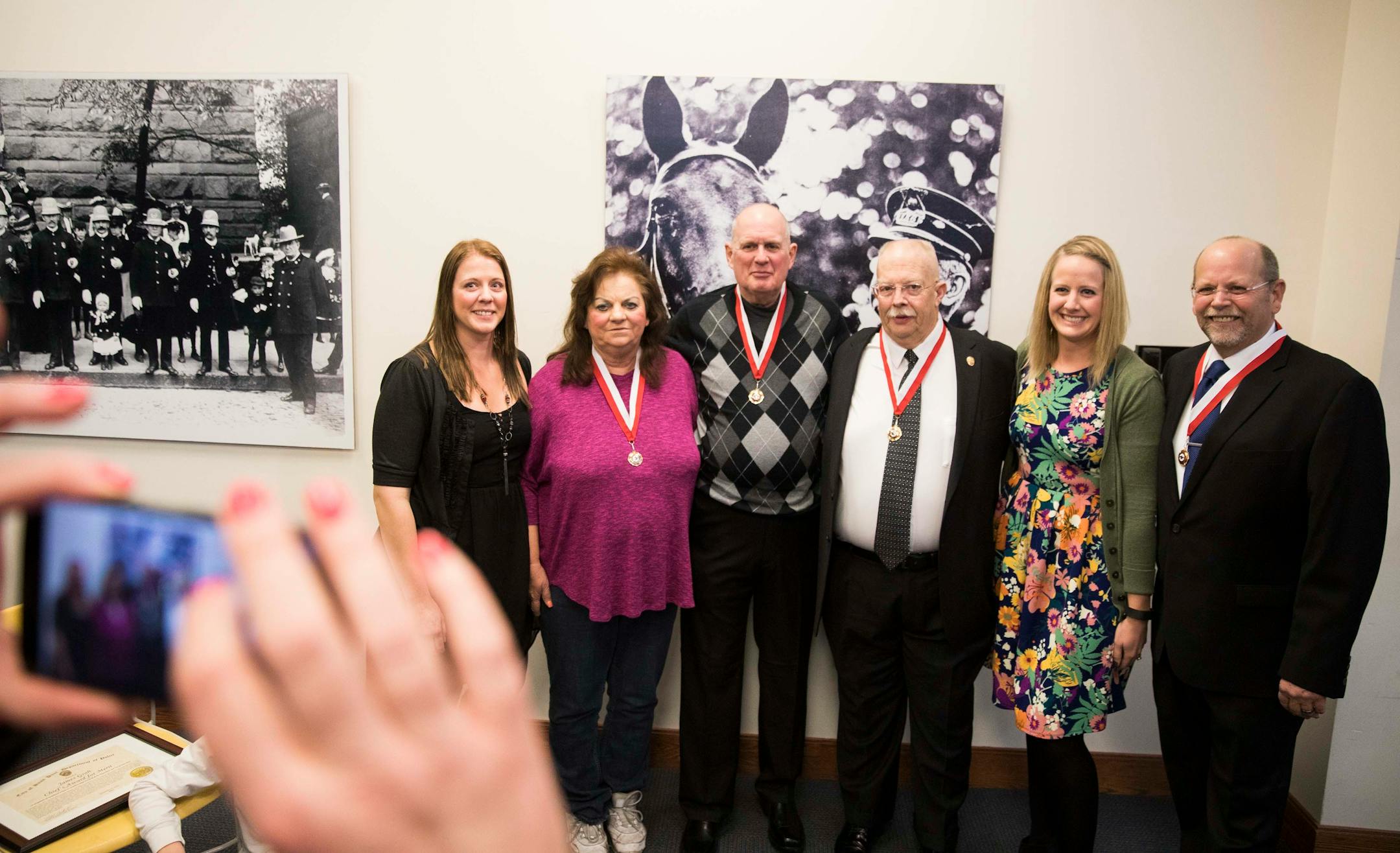Those who helped break the case pose for a photo with family members of Cassie Hansen after the ceremony. From left is Cassie's sister Ashley Withrow, Dorothy Noga, the civilian who broke the case, retired officers James Groh and Richard Klein, Cassie's sister Brittany Koller, and retired officer Patrick Scott.] LEILA NAVIDI ï leila.navidi@startribune.com BACKGROUND INFORMATION: Thirty-six years after 6-year-old Cassie Hansen was kidnapped, strangled and left in dumpster, the team of officers an