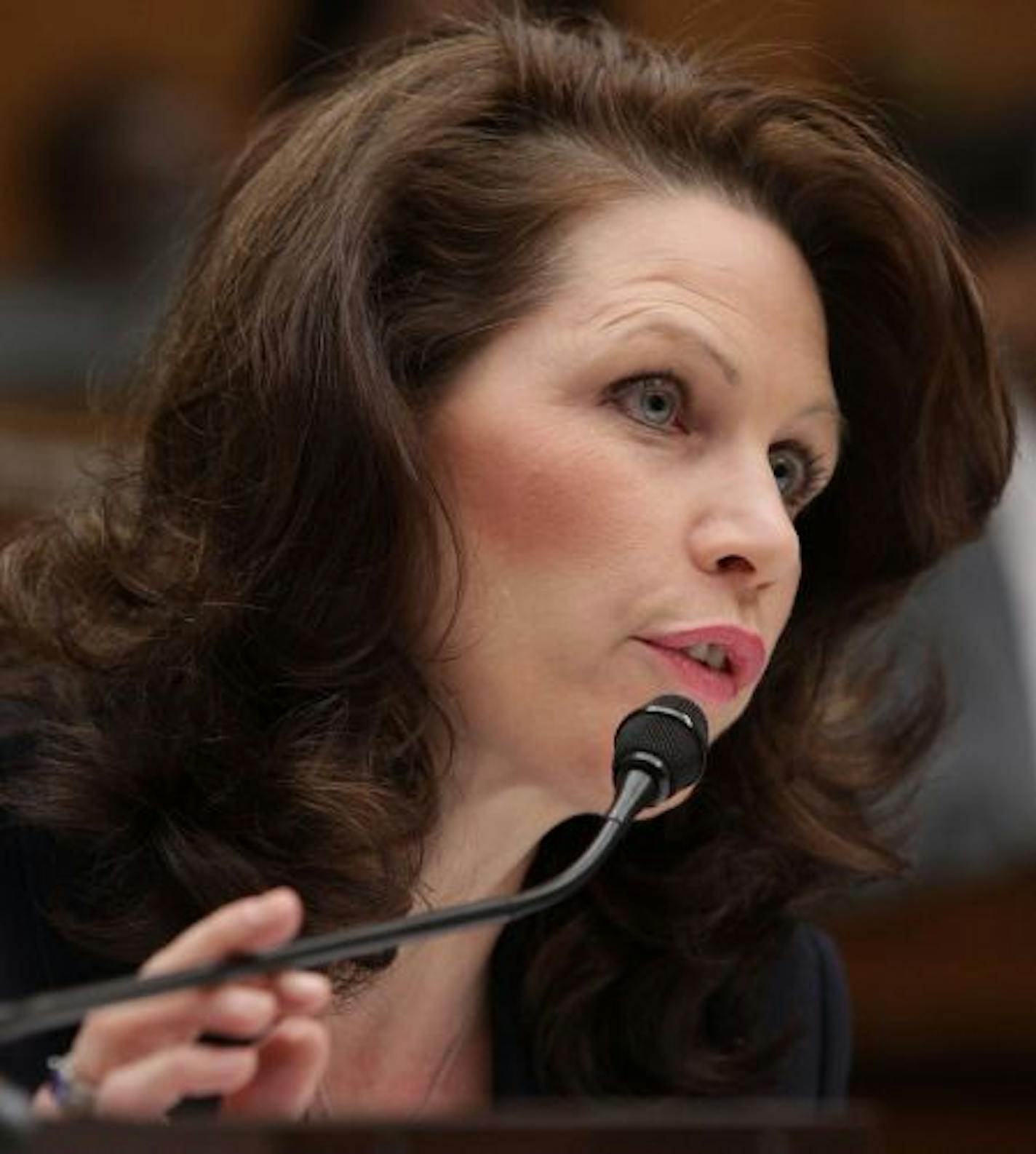 WASHINGTON - MARCH 24: Rep. Michele Bachmann (R-MN) questions Federal Reserve Chairman Ben Bernanke, during a House Financial Services Committee hearing on Capitol Hill on March 24, 2009 in Washington, DC. The committee is hearing testimony on the Federal Government's Intervention at American International Group (AIG).