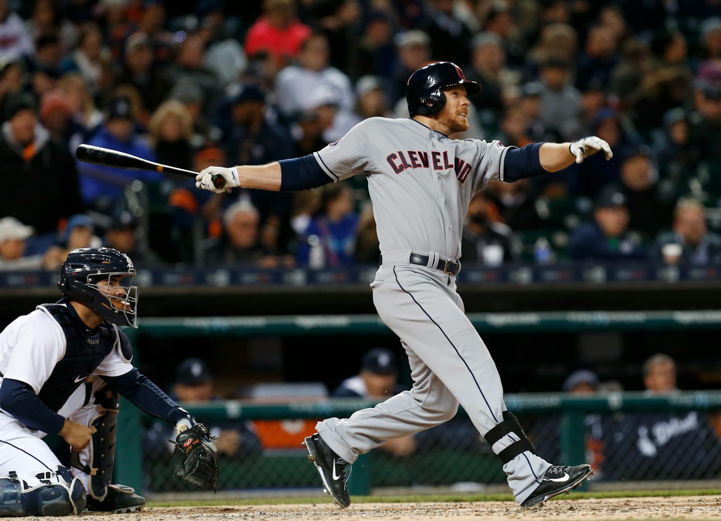 Cleveland Indians' Brandon Moss, right, hits a three-run home run against the Detroit Tigers in the fifth inning of a baseball game in Detroit, Friday, April 24, 2015. (AP Photo/Paul Sancya)