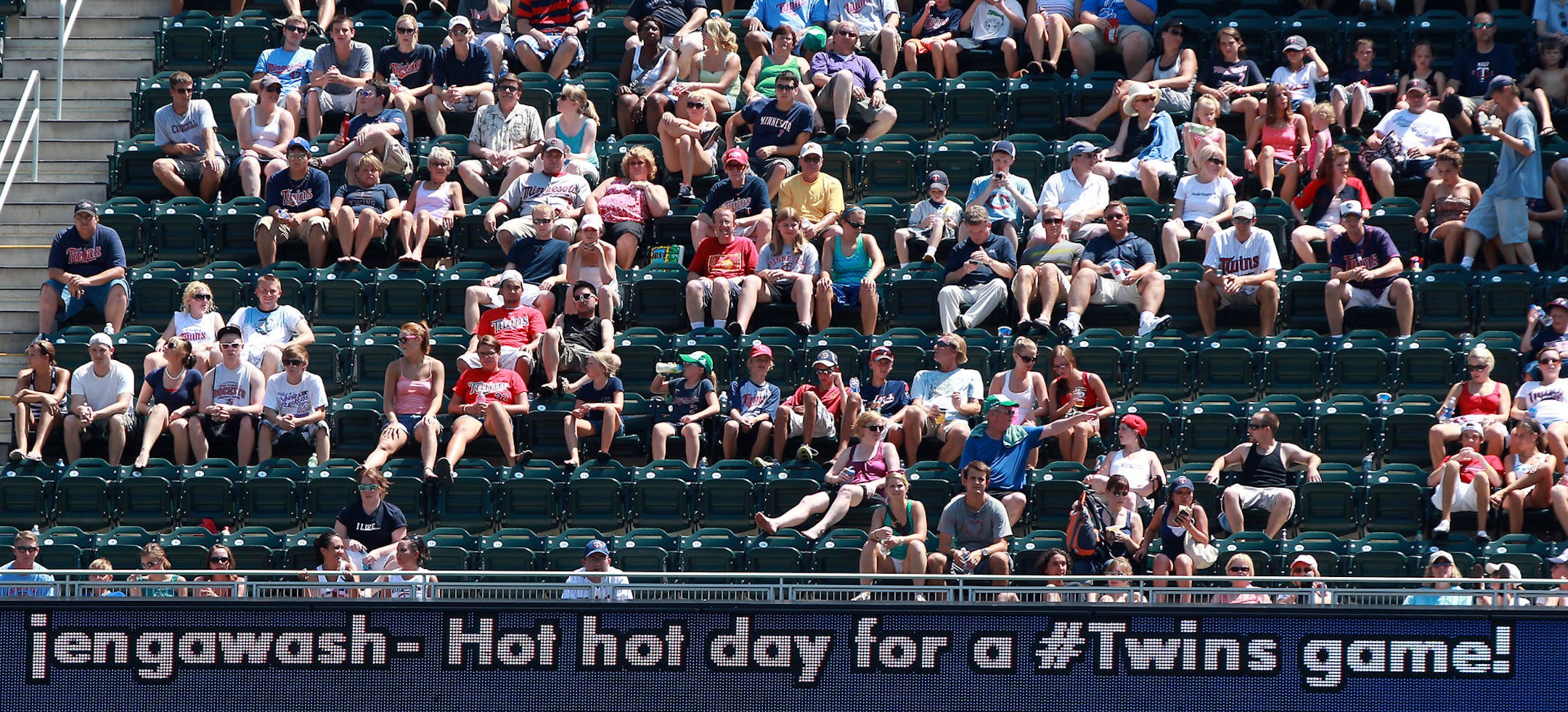Fans at a Twins game at Target Field observing Perfect Fan Rule No. 1: Don't do the wave.