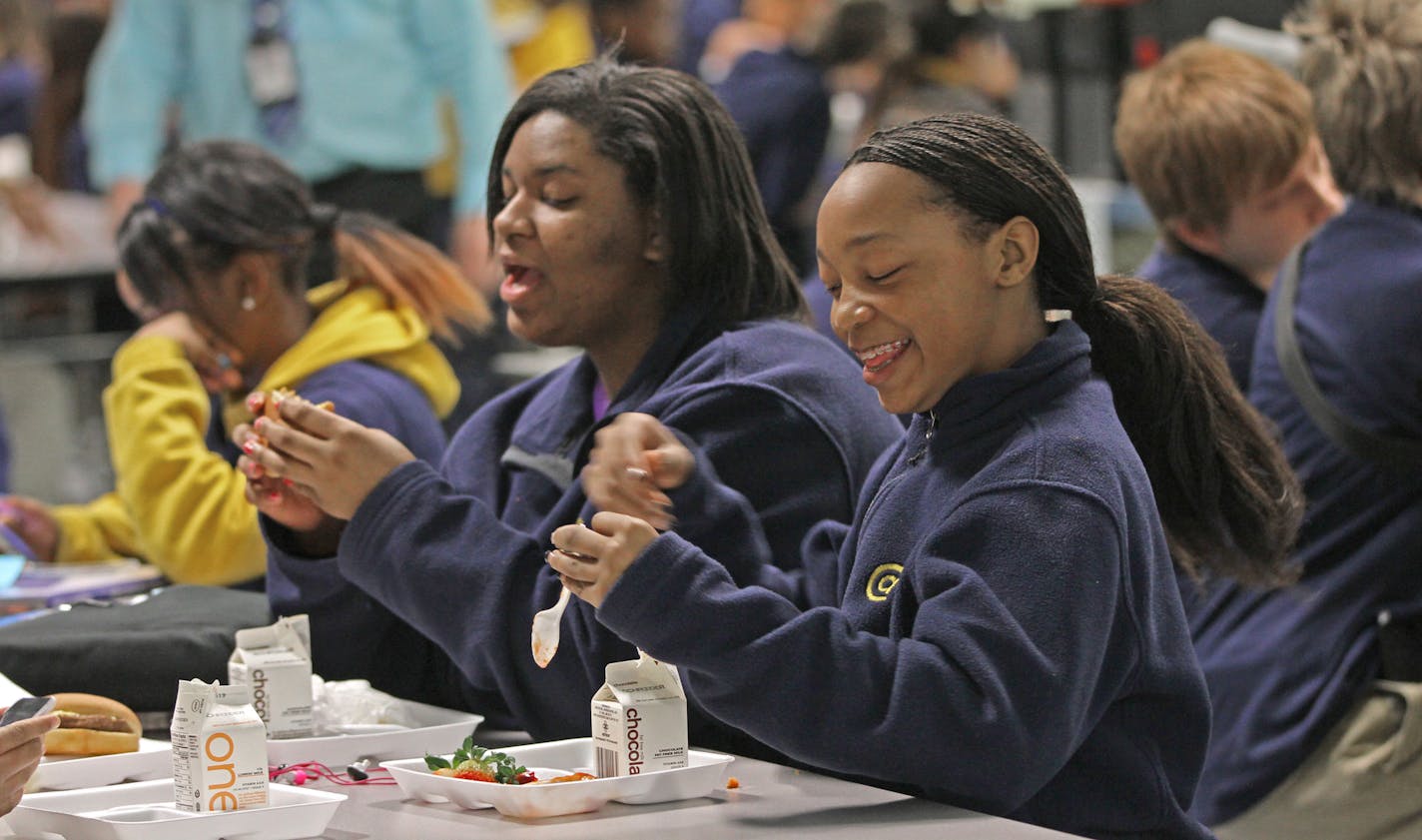 (left to right) Columbia Academy students Delejah Frazier, 8th grade and Tywana Robertson, 7th grade, had lunch on 4/17/13 at the Columbia Heighs school. All students at Columbia Academy wear uniforms and one other district elementary school is scheduled to switch to uniforms next year.] Bruce Bisping/Star Tribune bbisping@startribune.com Delejah Frazier, Tywana Robertson/source.