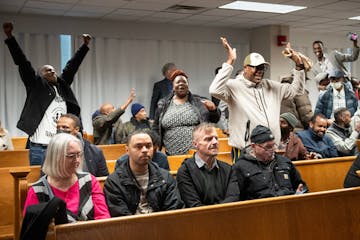 Rideshare supporters cheer as the Minneapolis City Council voted to override Mayor Jacob Frey’s veto inside Council Chambers in Minneapolis on Thurs