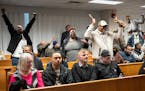 Rideshare supporters cheer as the Minneapolis City Council voted to override Mayor Jacob Frey’s veto inside Council Chambers in Minneapolis on Thurs