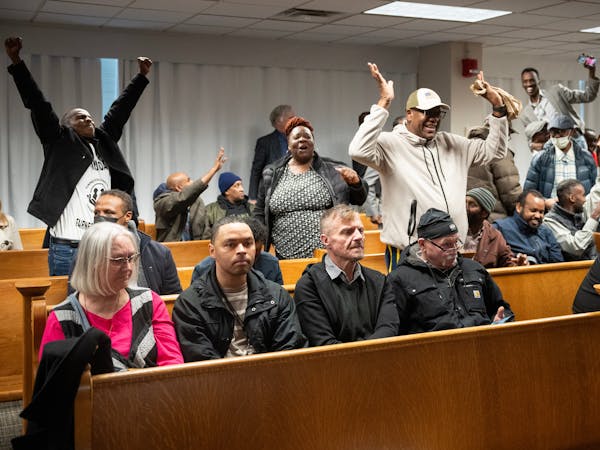 Rideshare supporters cheer as the Minneapolis City Council voted to override Mayor Jacob Frey’s veto inside Council Chambers in Minneapolis on Thurs