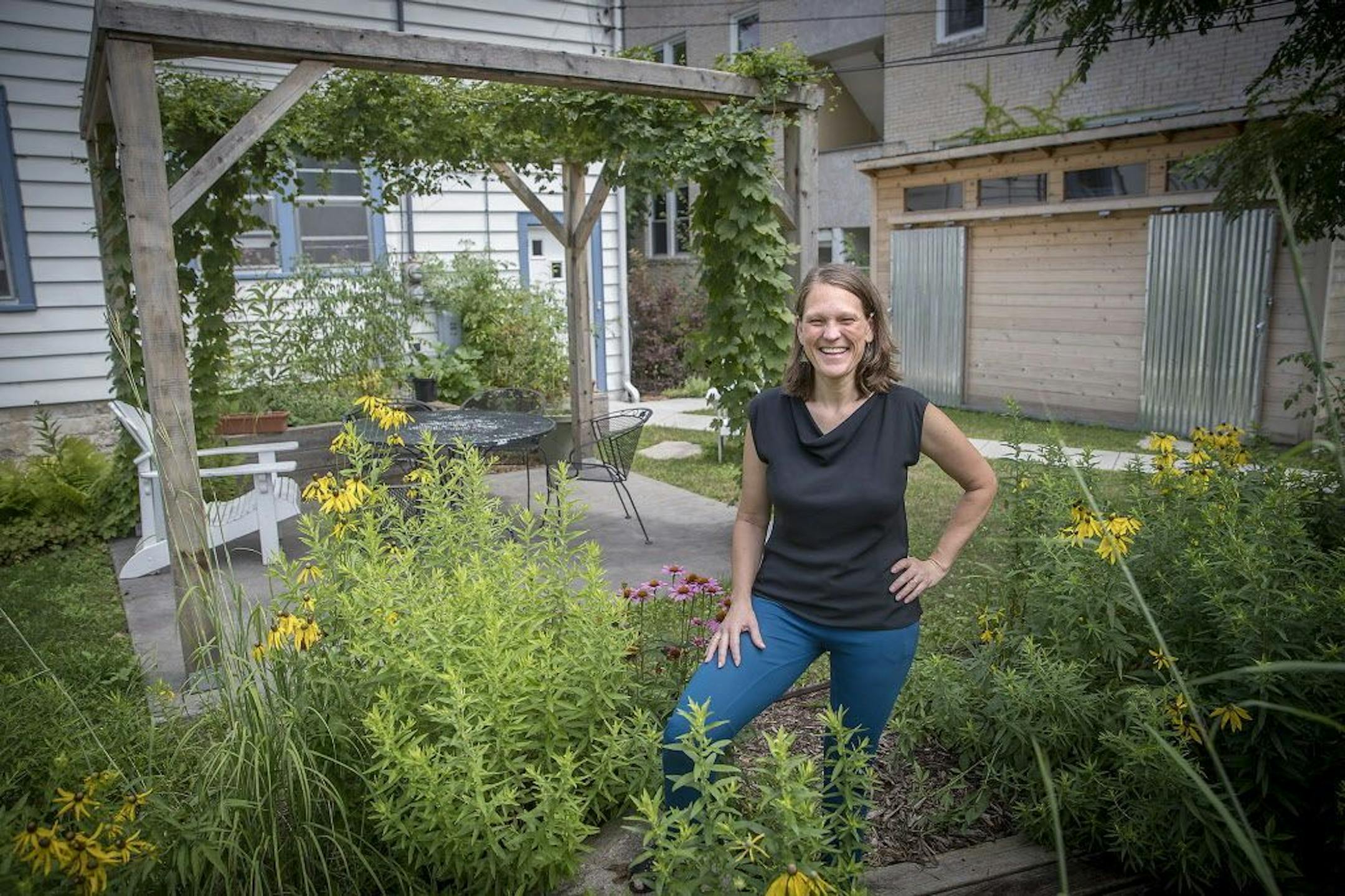 Janne Flisrand has owned and lived in her four-unit building in Uptown for 22 years. She recently relandscaped her backyard to create a community garden.
