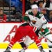 Minnesota Wild's Mikko Koivu (9) wins a face-off against the Carolina Hurricanes during the first period of an NHL hockey game, Saturday, Oct. 7, 2017