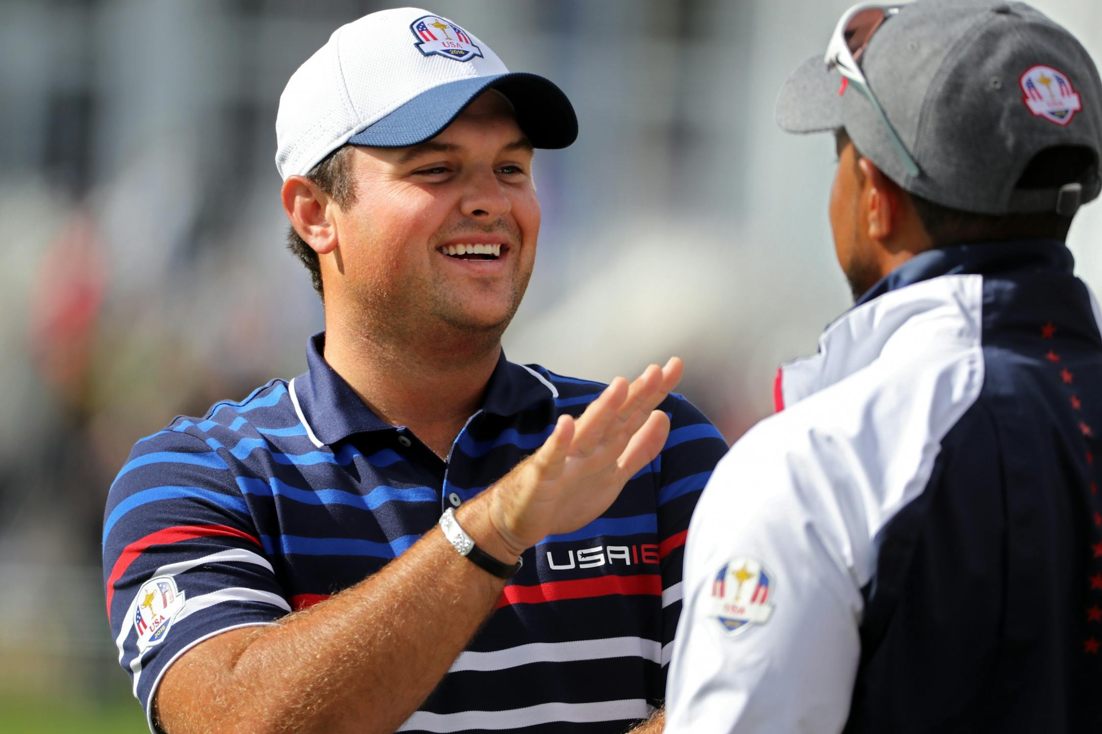 Team USA�s Patrick Reed talks with Vice Captain Tiger Woods on the Pratice Tee Thursday morning.